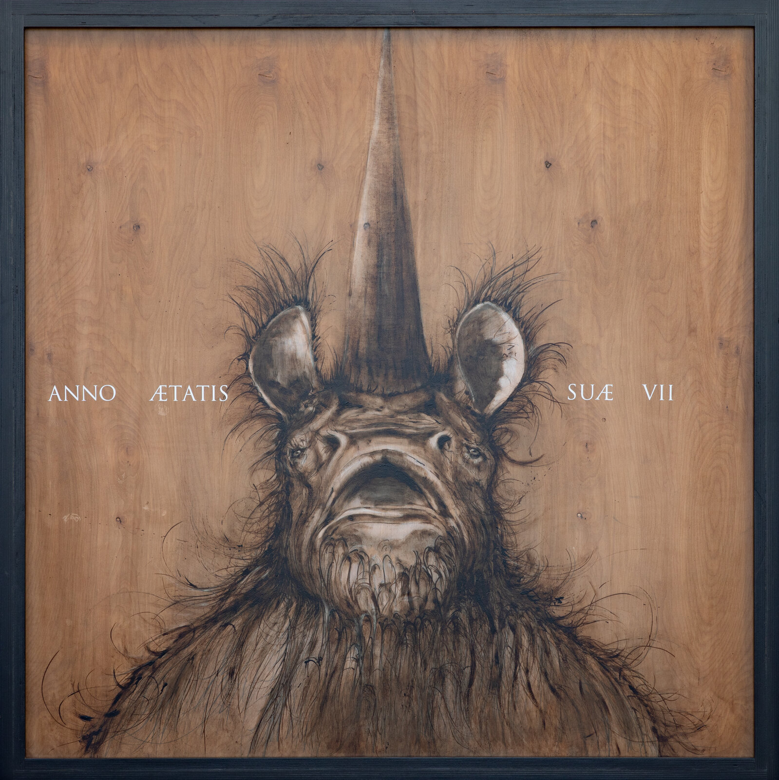 A hyper-realistic charcoal sketch of a rhinoceros head on a wood-grain background with white text.