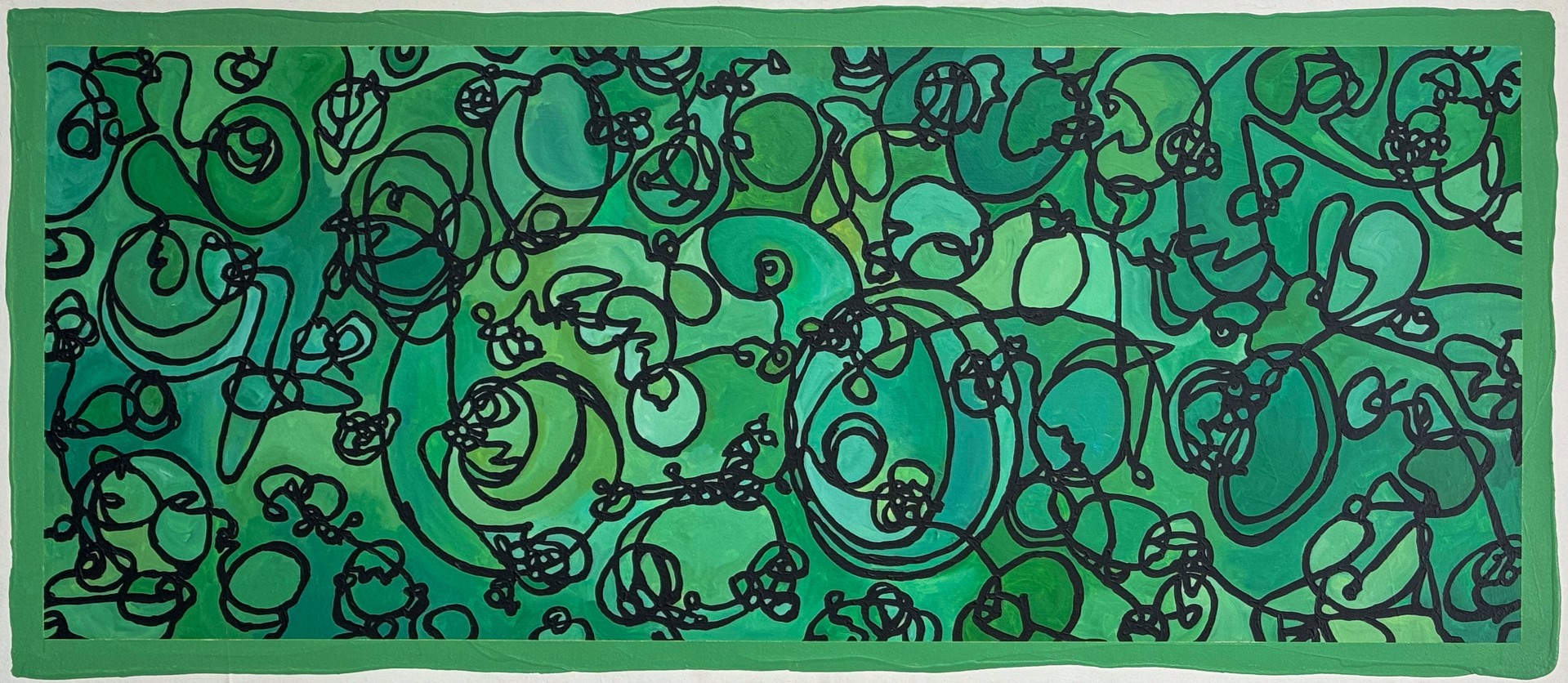 A green and black painting on a white wall.