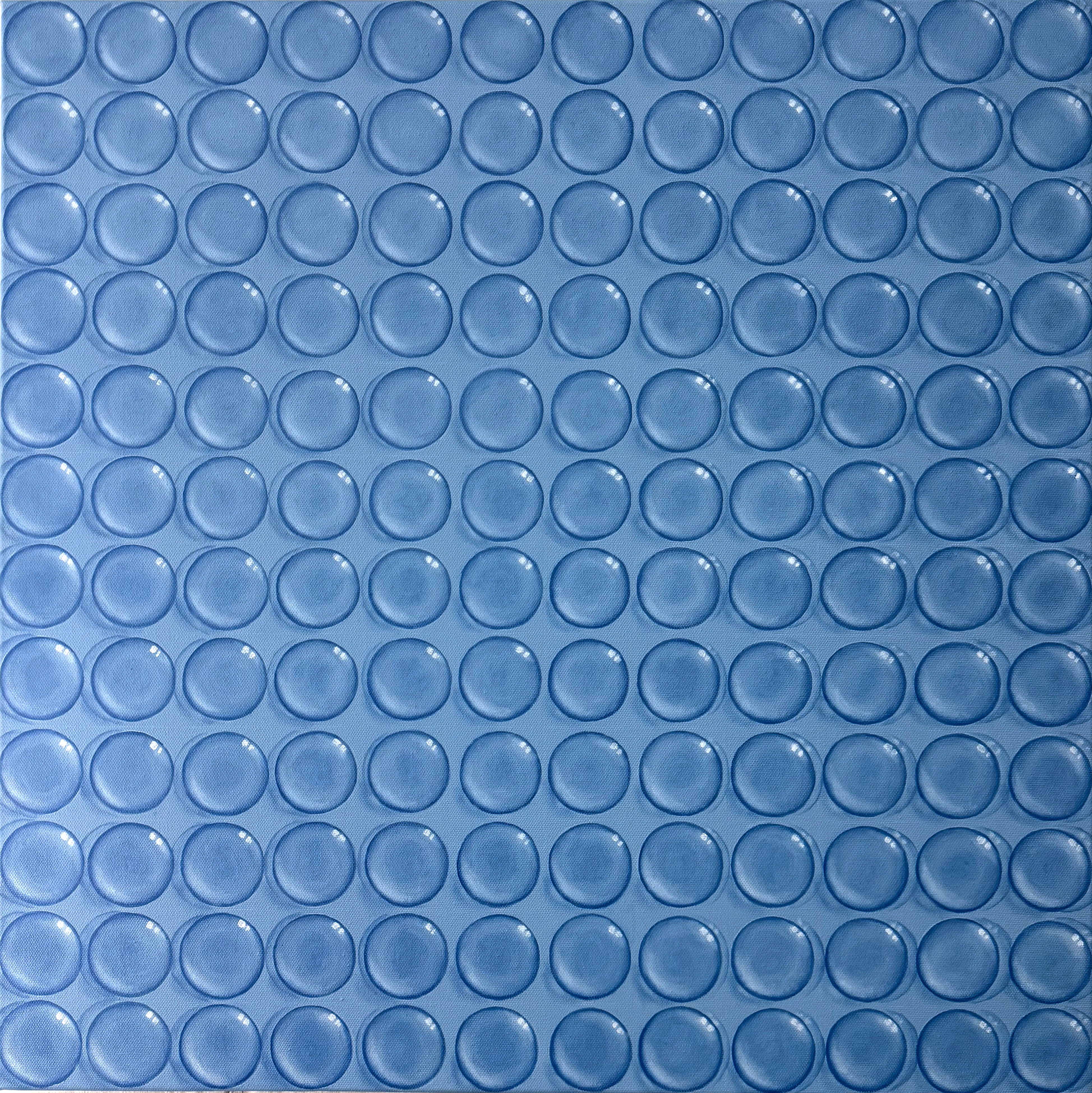 A close up of a blue glass mosaic tile.