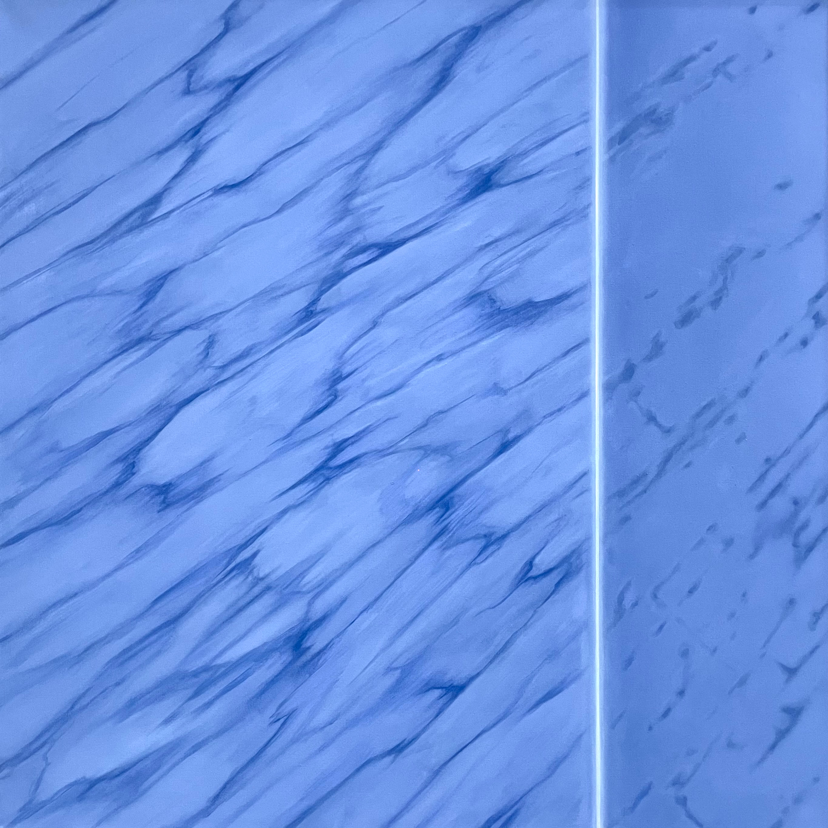 A close up of a blue marble wall with a white background.
