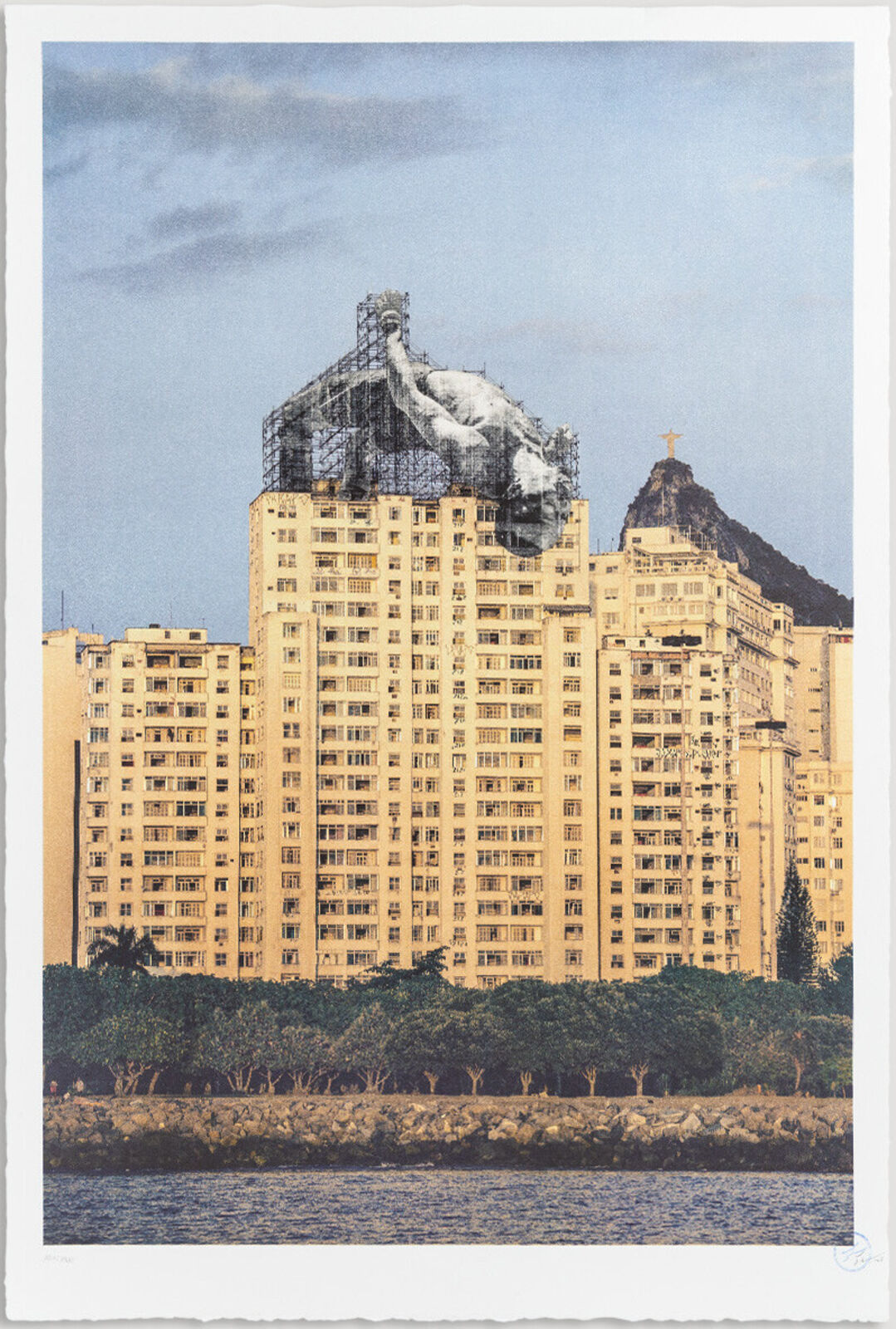 A picture of a building with a statue on top of it.