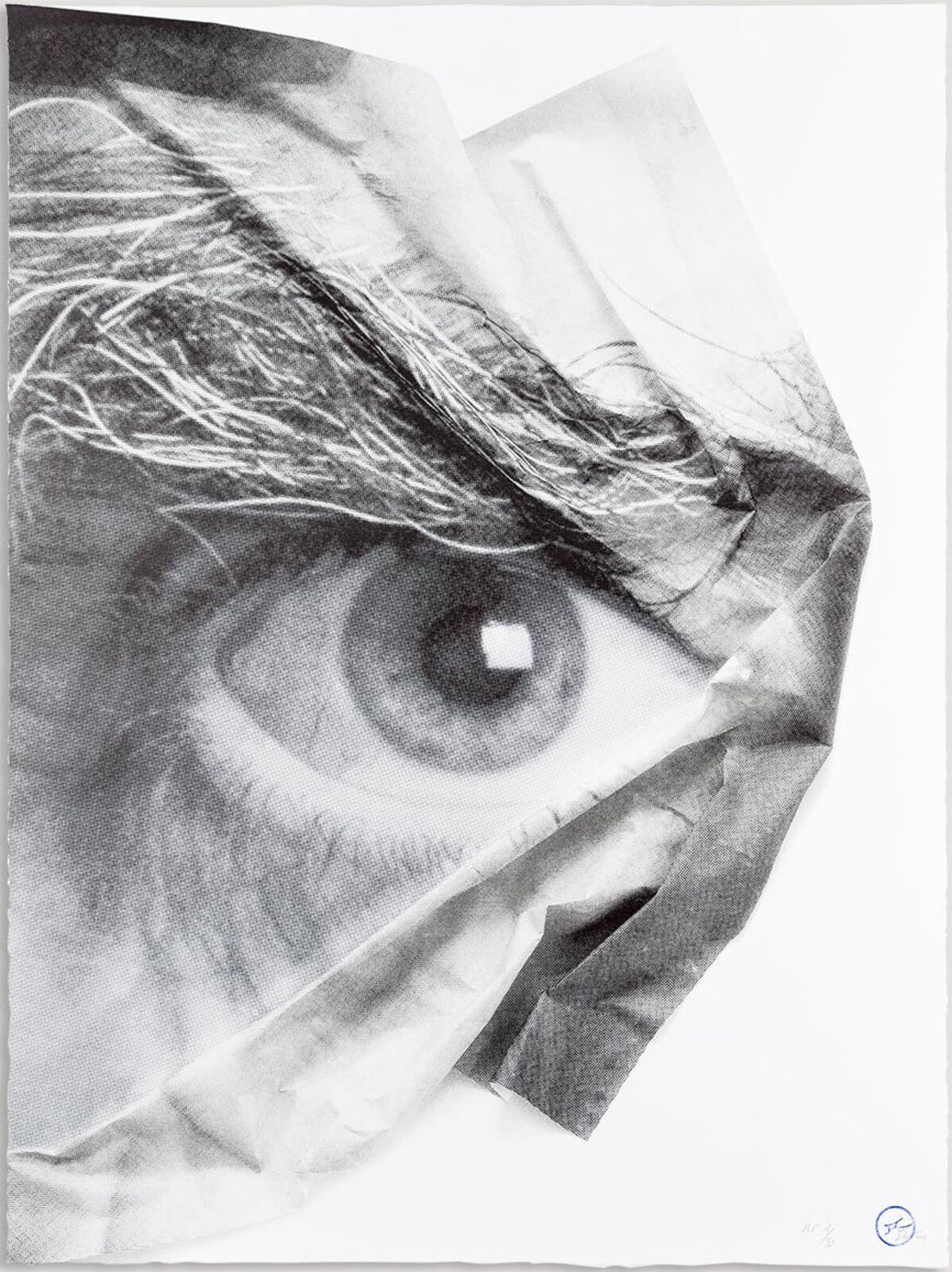 A black and white drawing of an eye on a piece of paper.