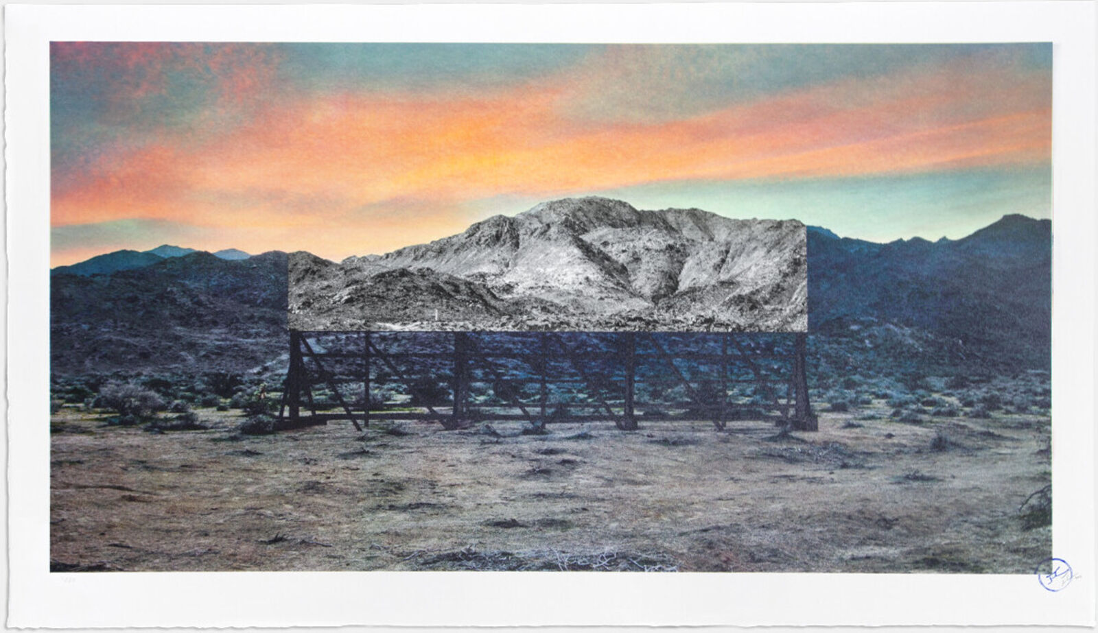 A picture of a desert landscape with mountains in the background.