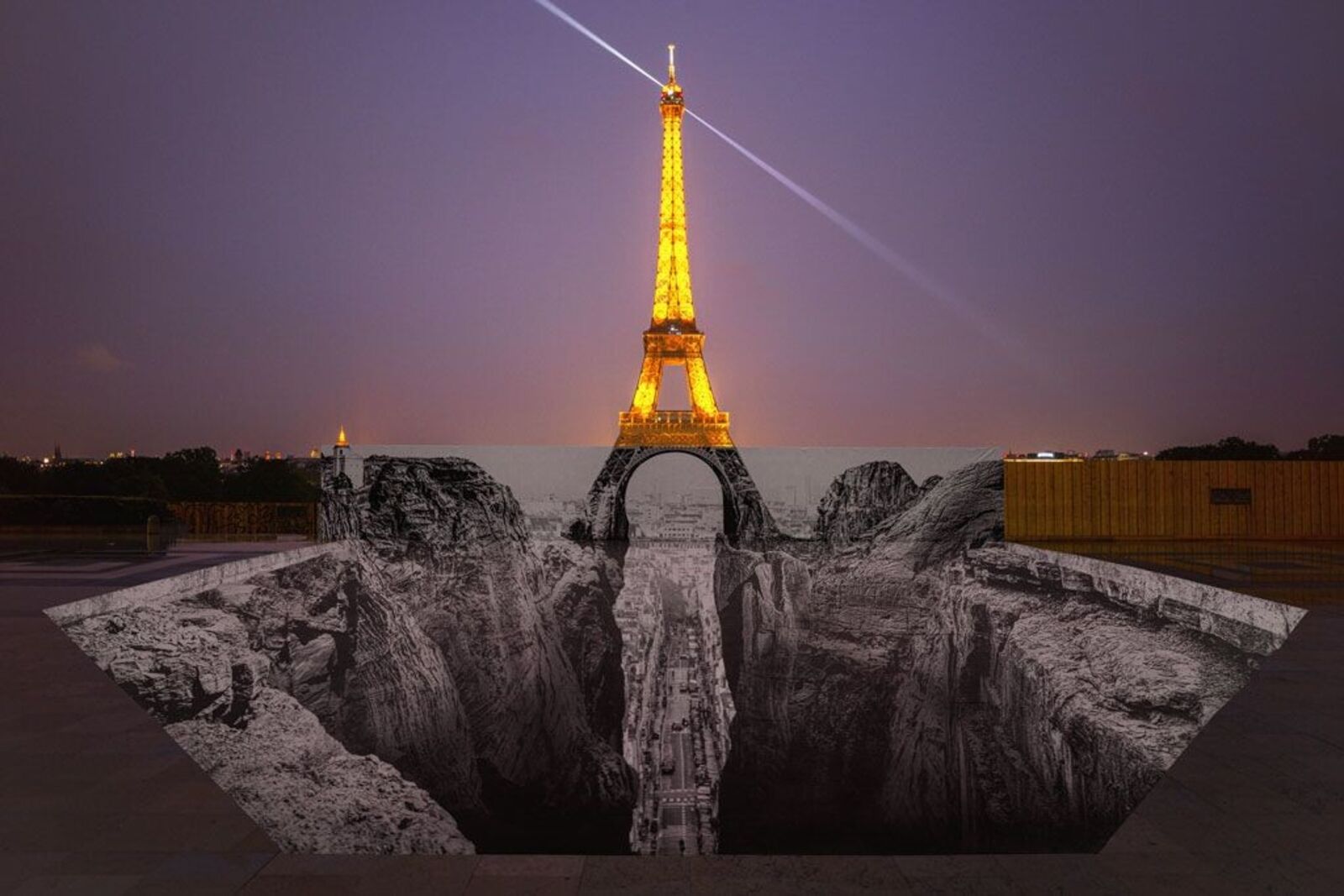 A composite of four surreal street art installations featuring a towering tower over a black-and-white chasm.