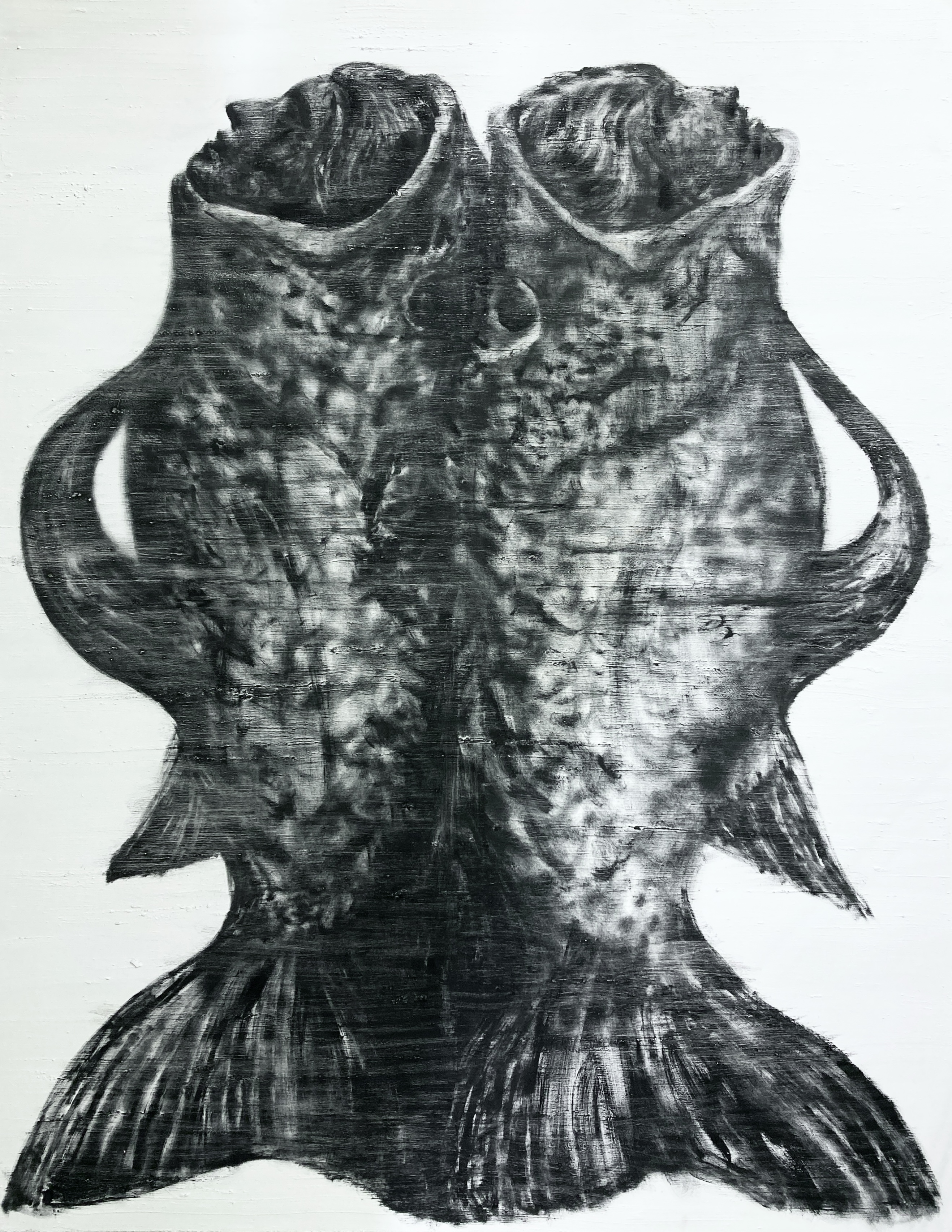 A black and white drawing of two fish on a white wall.