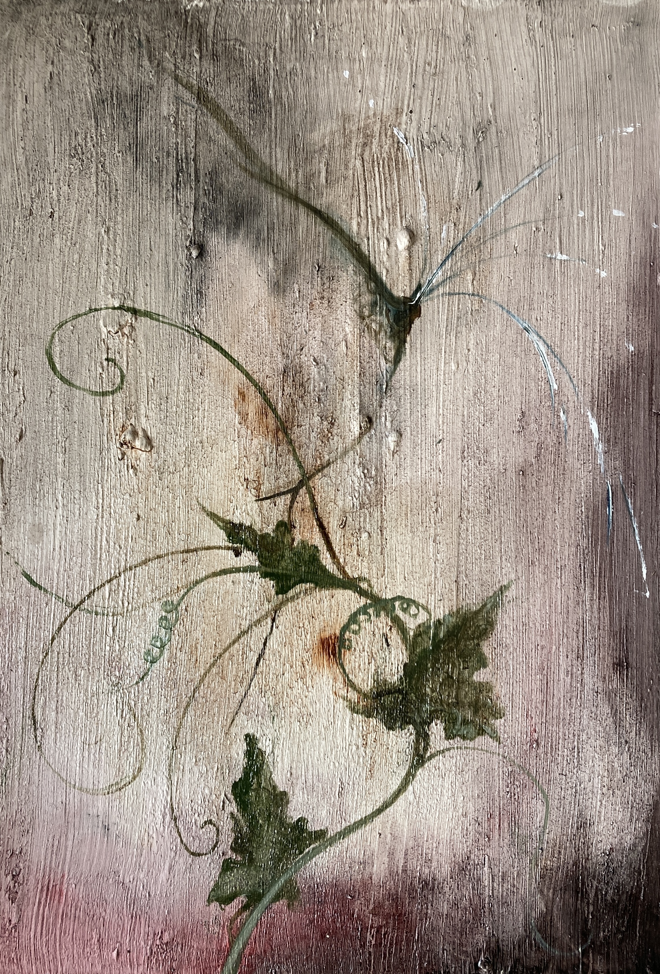 A close up of a painting of a plant on a wooden surface.