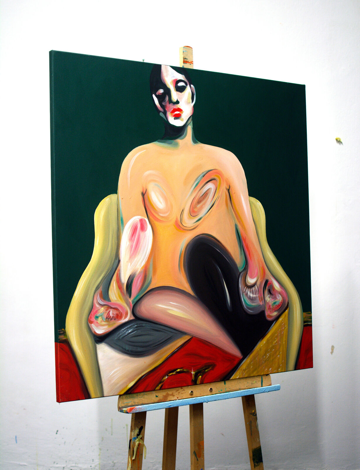 A painting of a nude woman sitting on a chair.