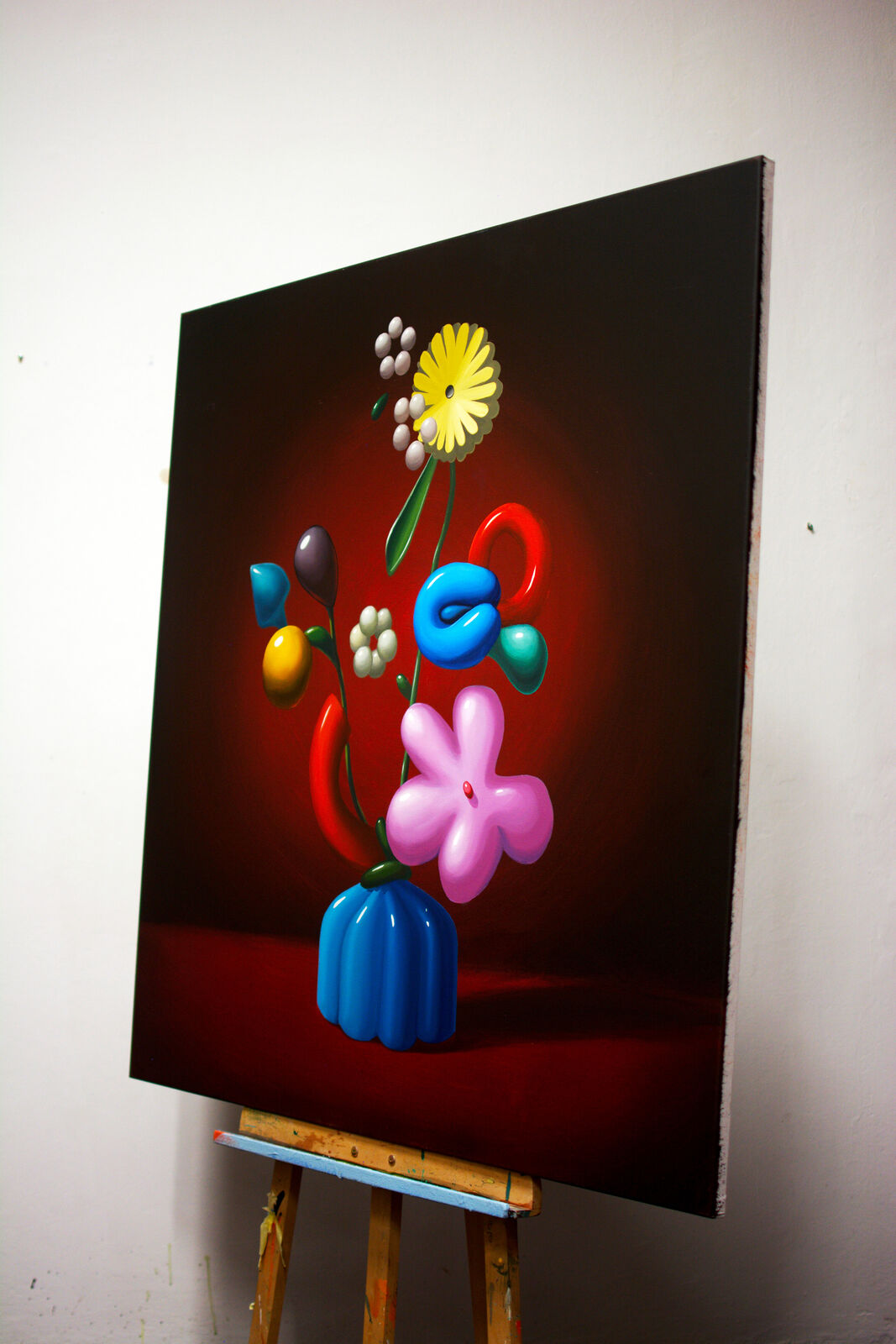 A painting of flowers in a blue vase on a table.