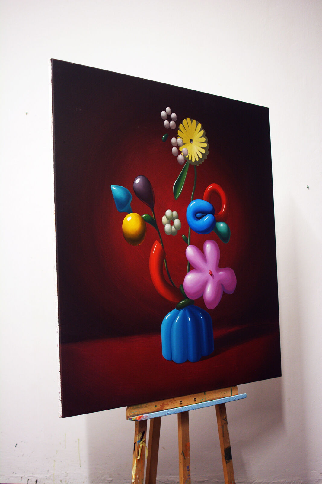A painting of flowers in a blue vase on a table.