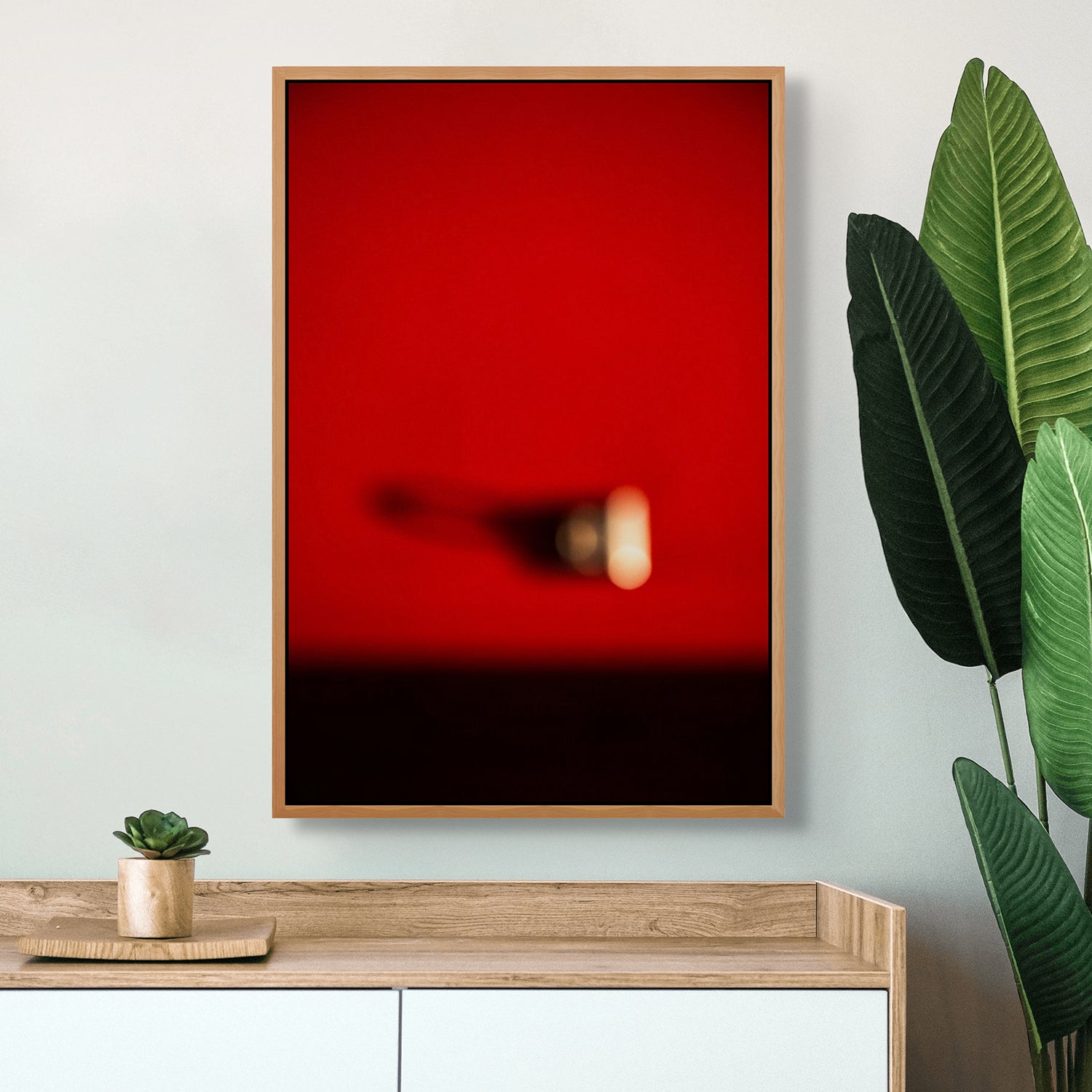 A blurry image of a person's shadow on a red background.