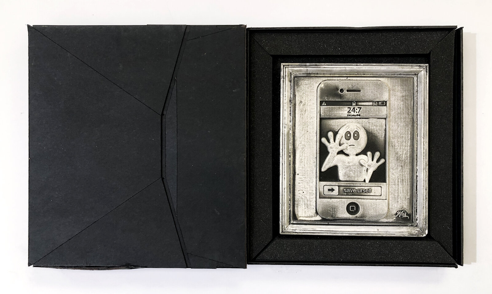 A picture of a cell phone with a sad face on it.