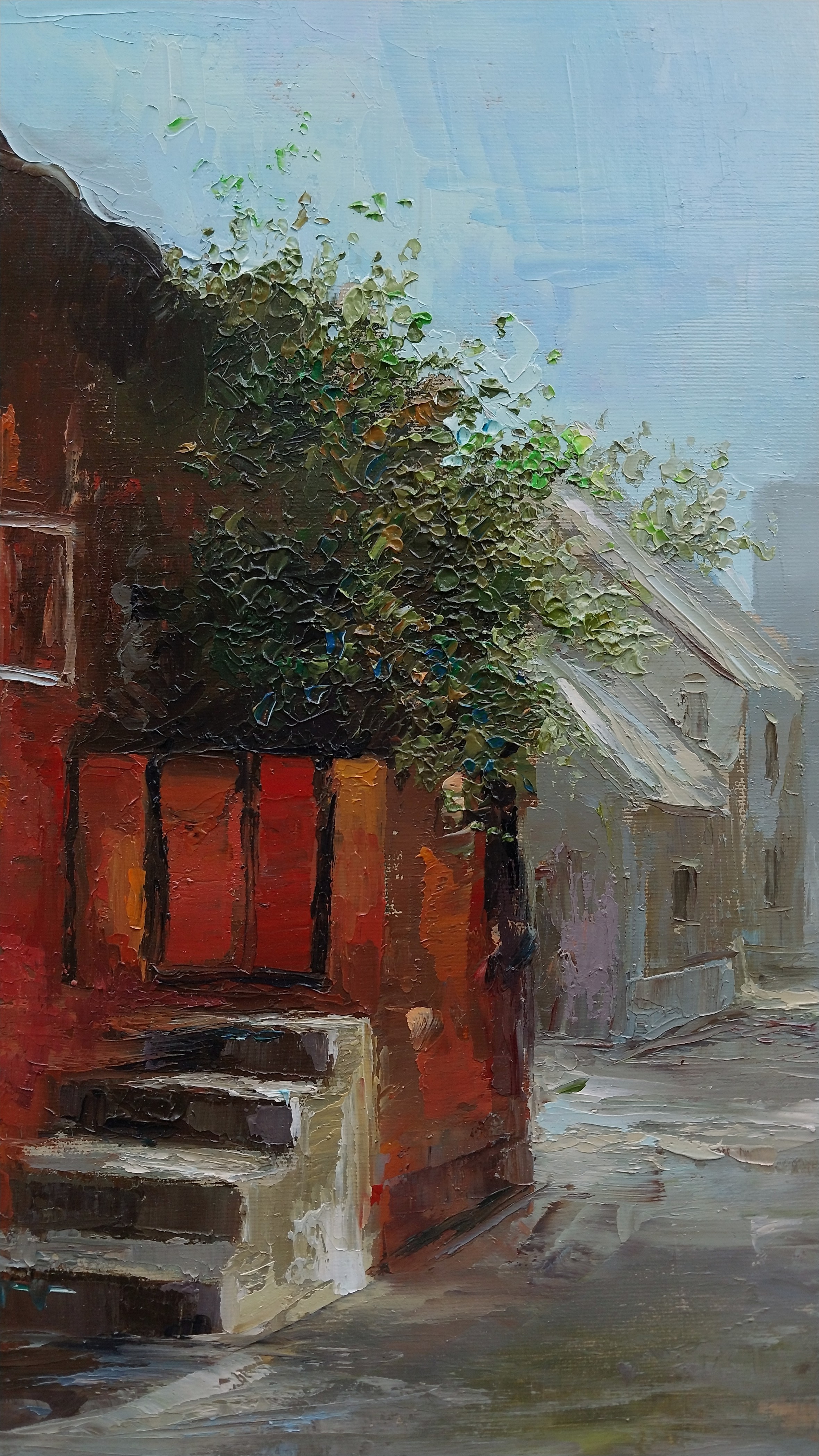 A textured oil painting of a quiet, misty street corner with a red building and green foliage.
