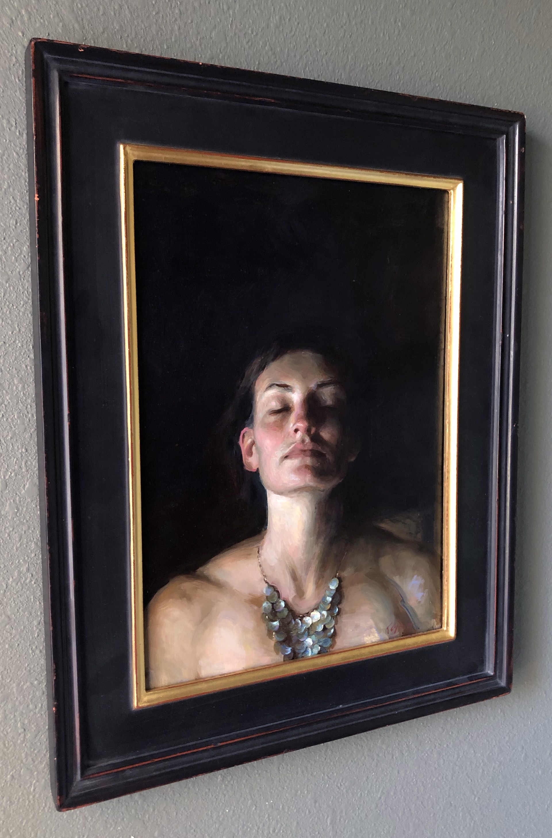 A painting of a woman with her eyes closed and a necklace on.