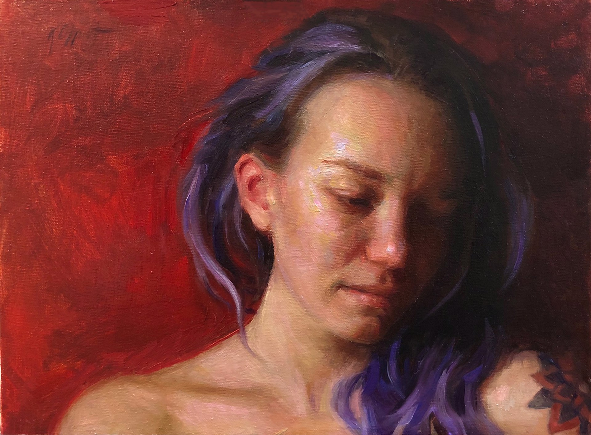 A portrait of a person with purple hair and a visible tattoo, set against a deep red background.