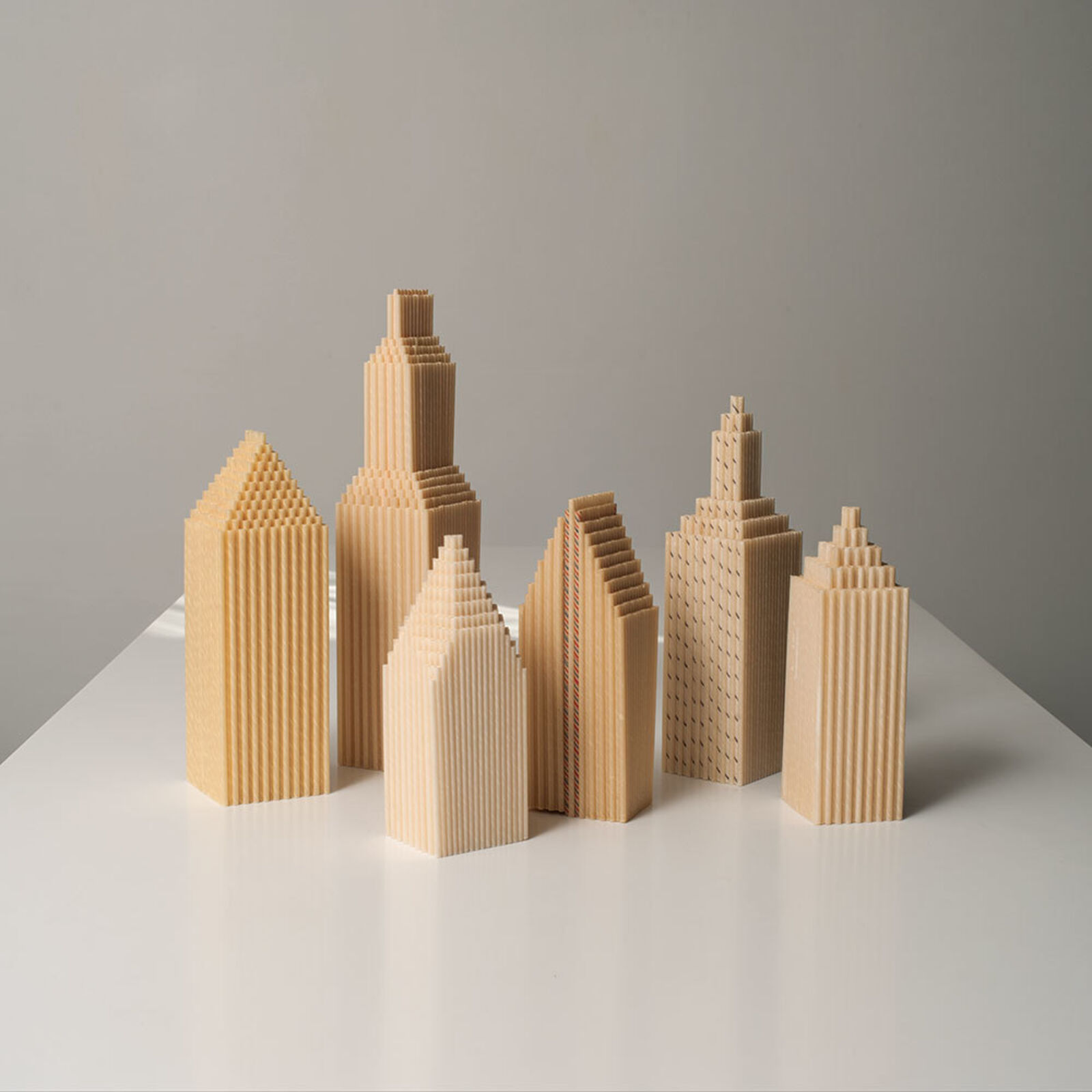 A group of wooden buildings sitting on top of a table.