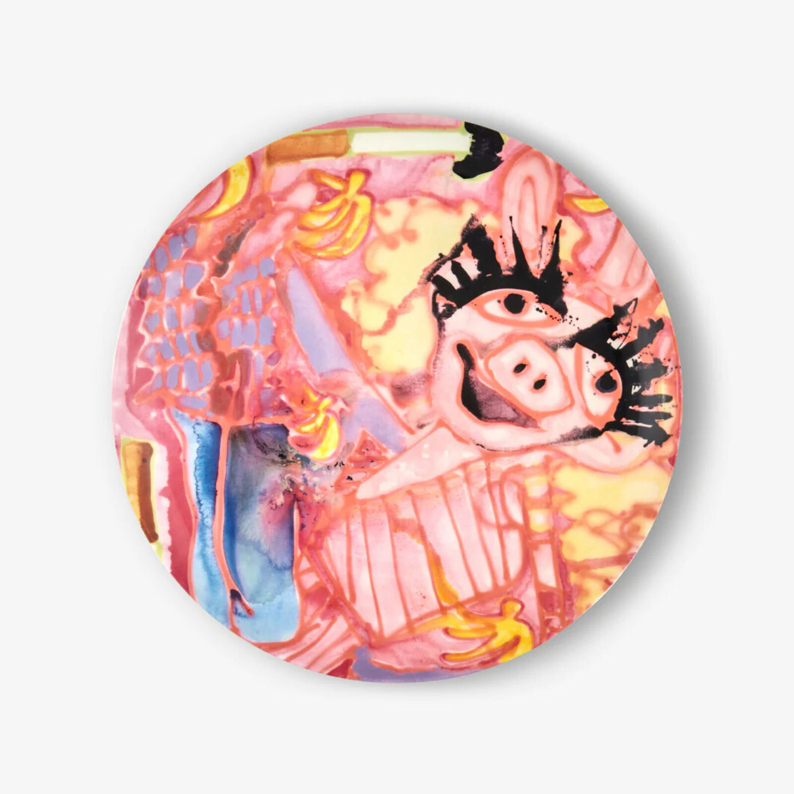 A pink plate with a painting of a pig on it.