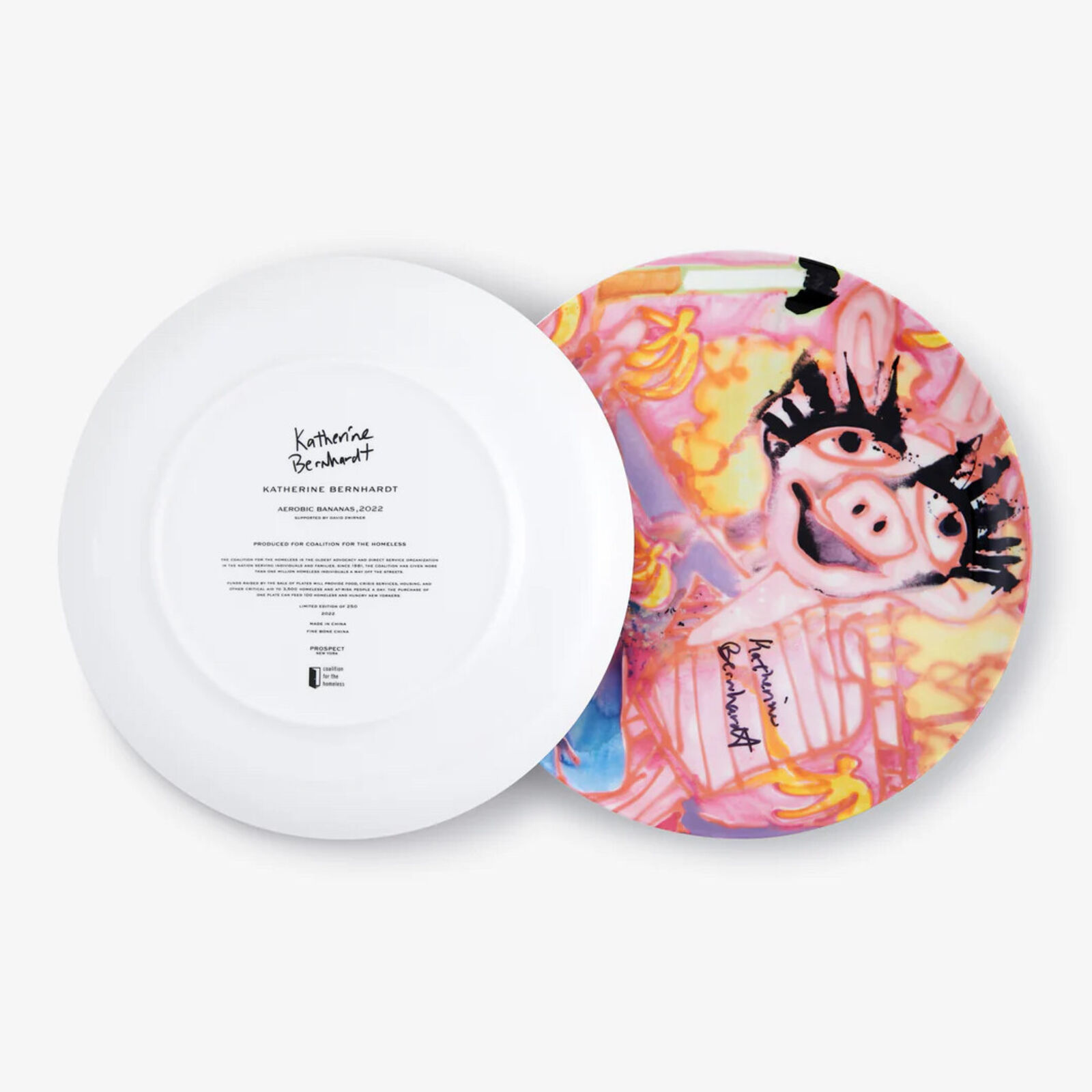 A pink plate with a painting of a pig on it.