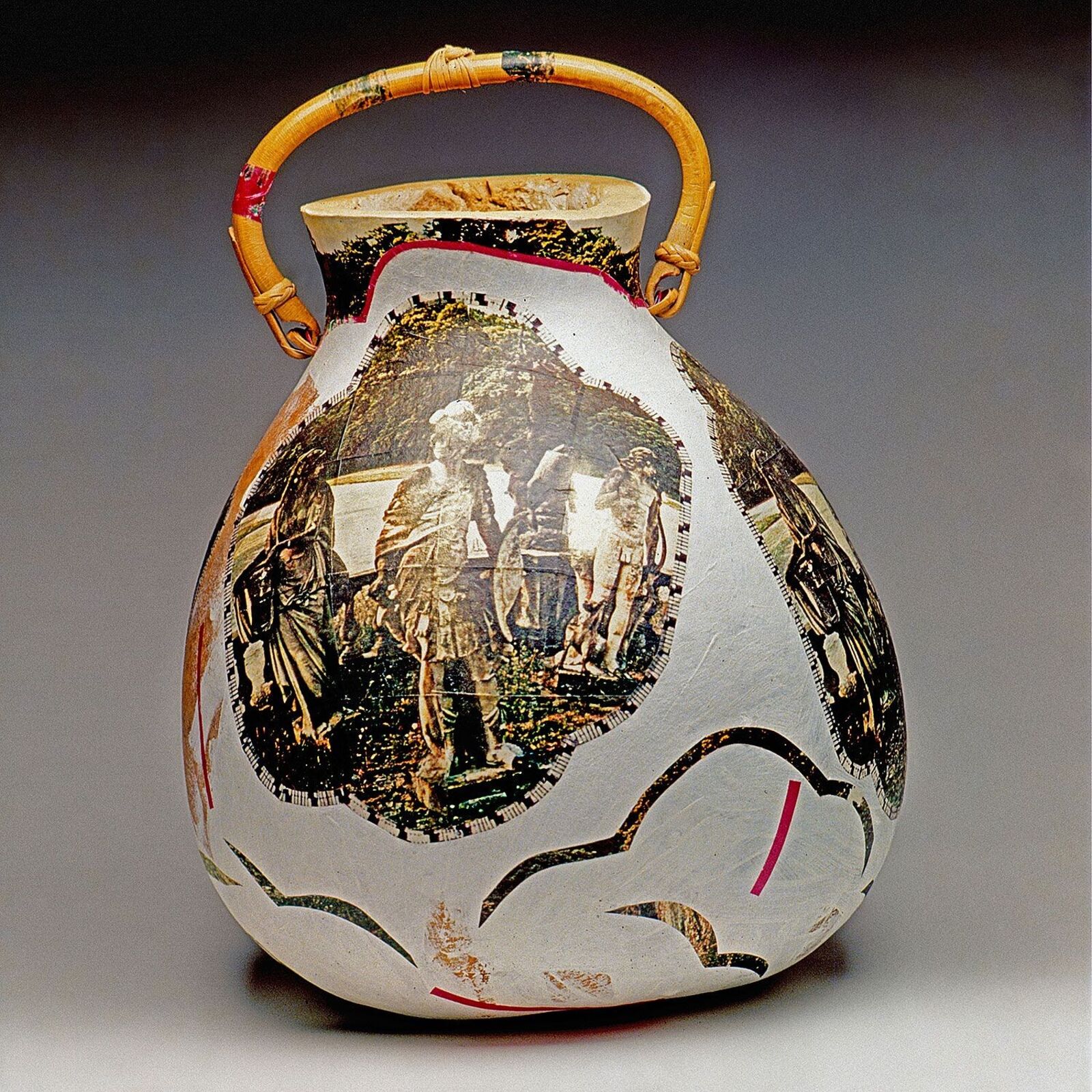 A vase with a picture of a group of people on it.