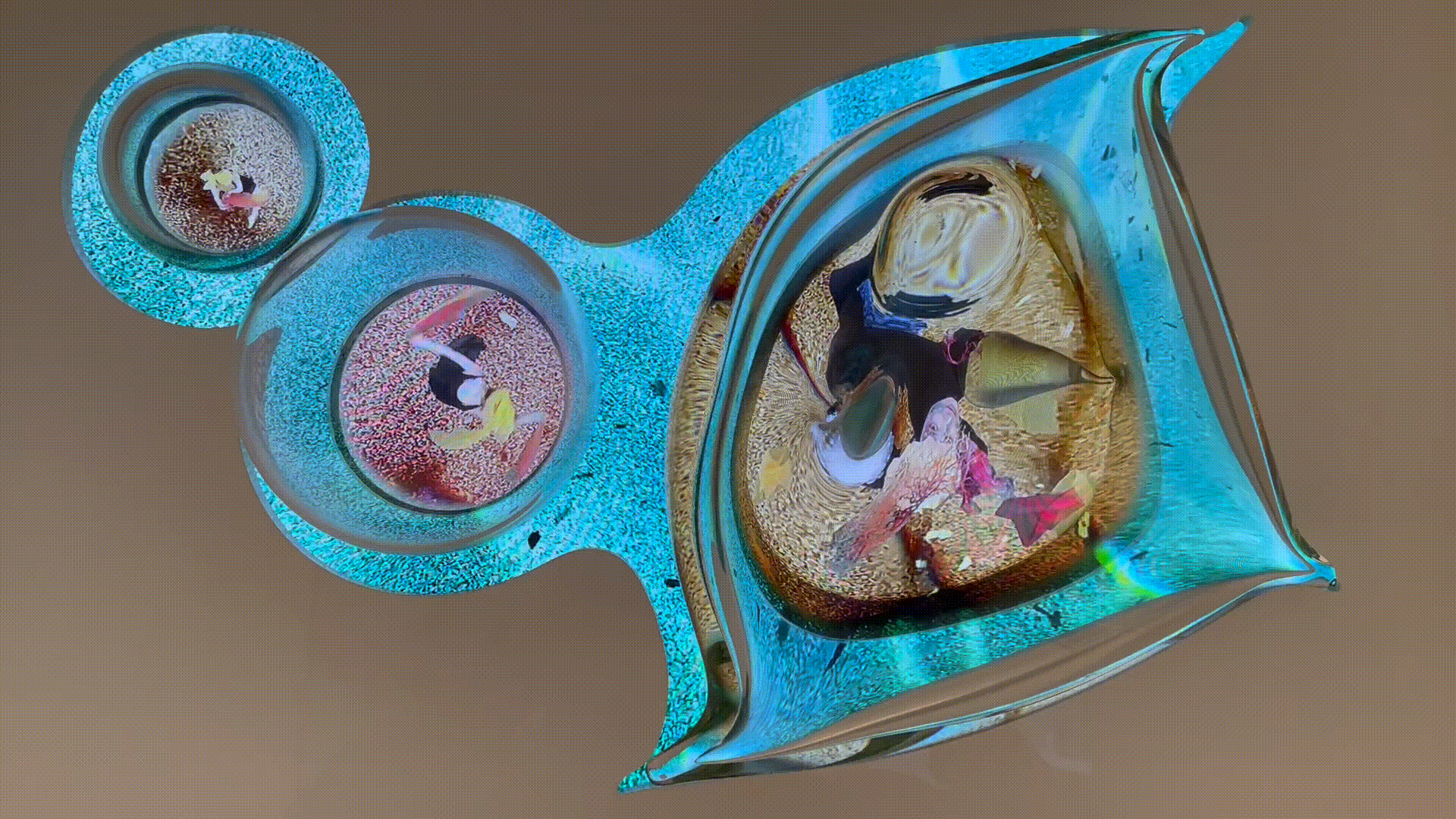 A close up of a glass object with a brown background.