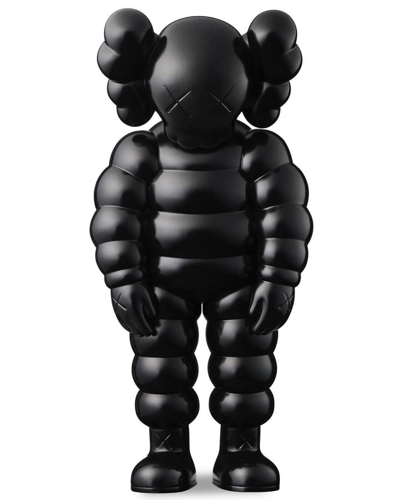A black kaws figure with a white background. 