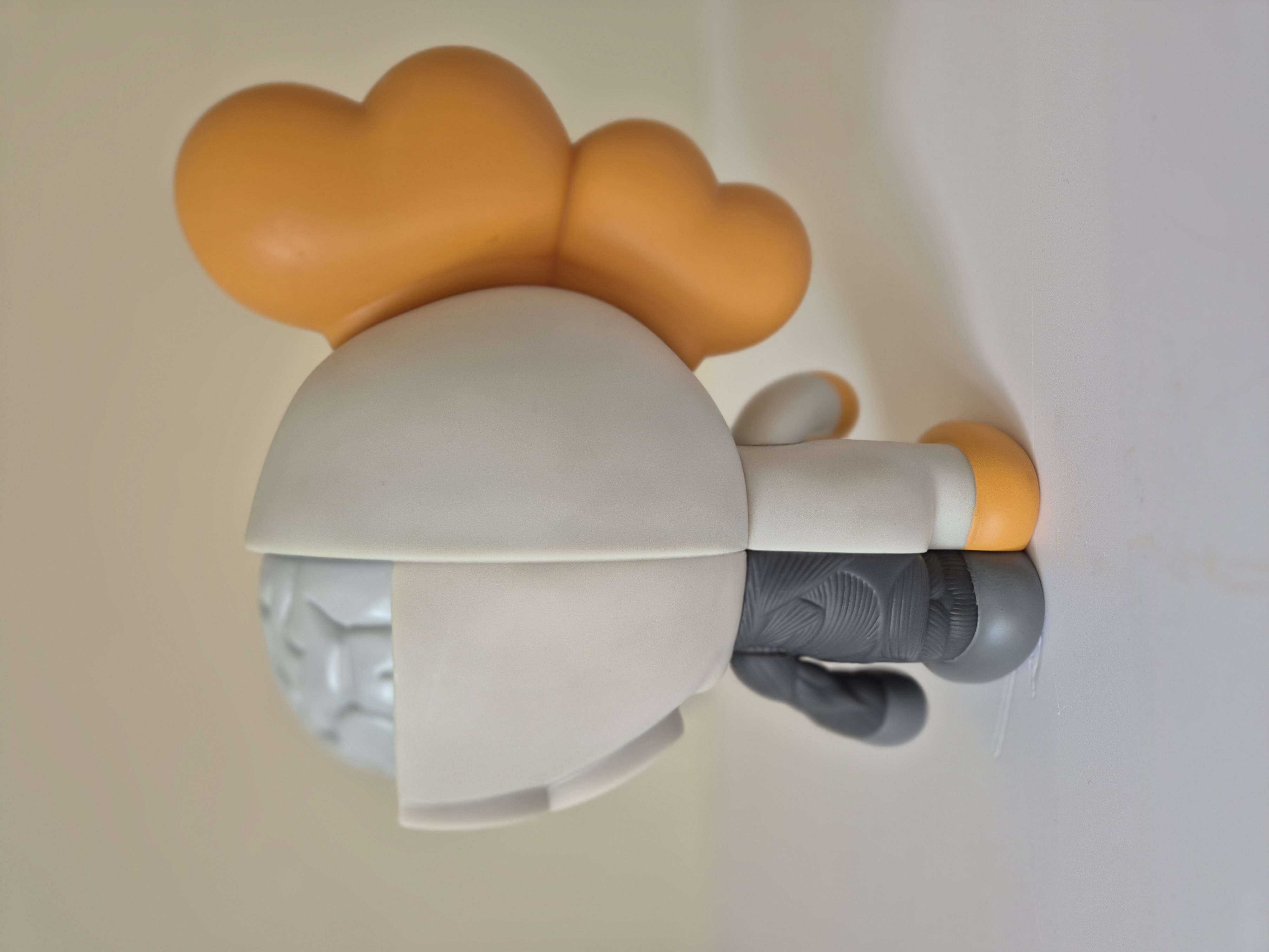 A toy that is sitting on top of a wall.