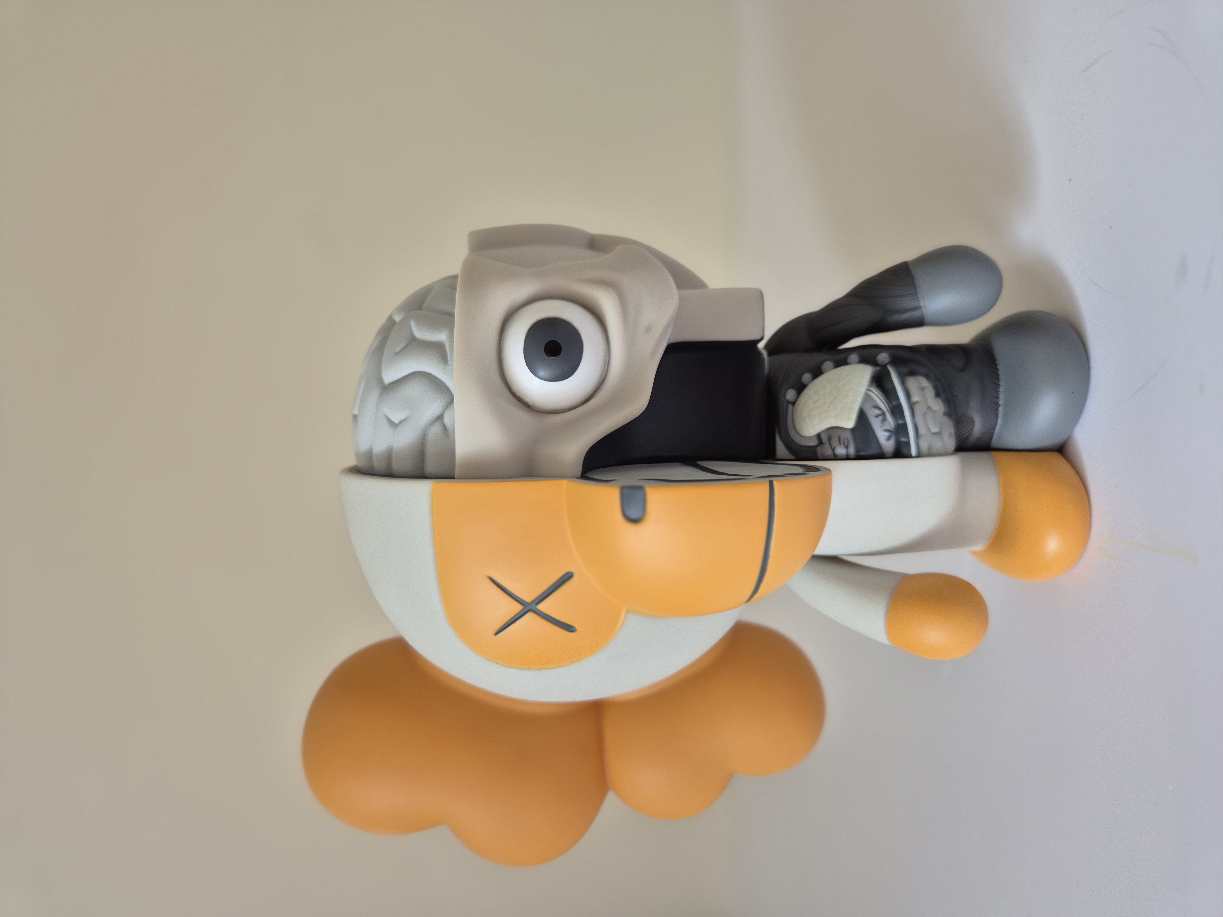 A toy that is sitting on top of a wall.