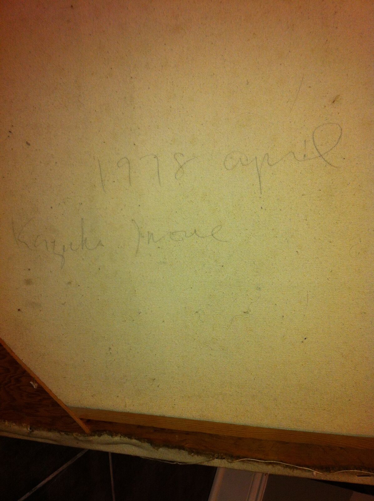 A painting on a wall with a red square in the middle.