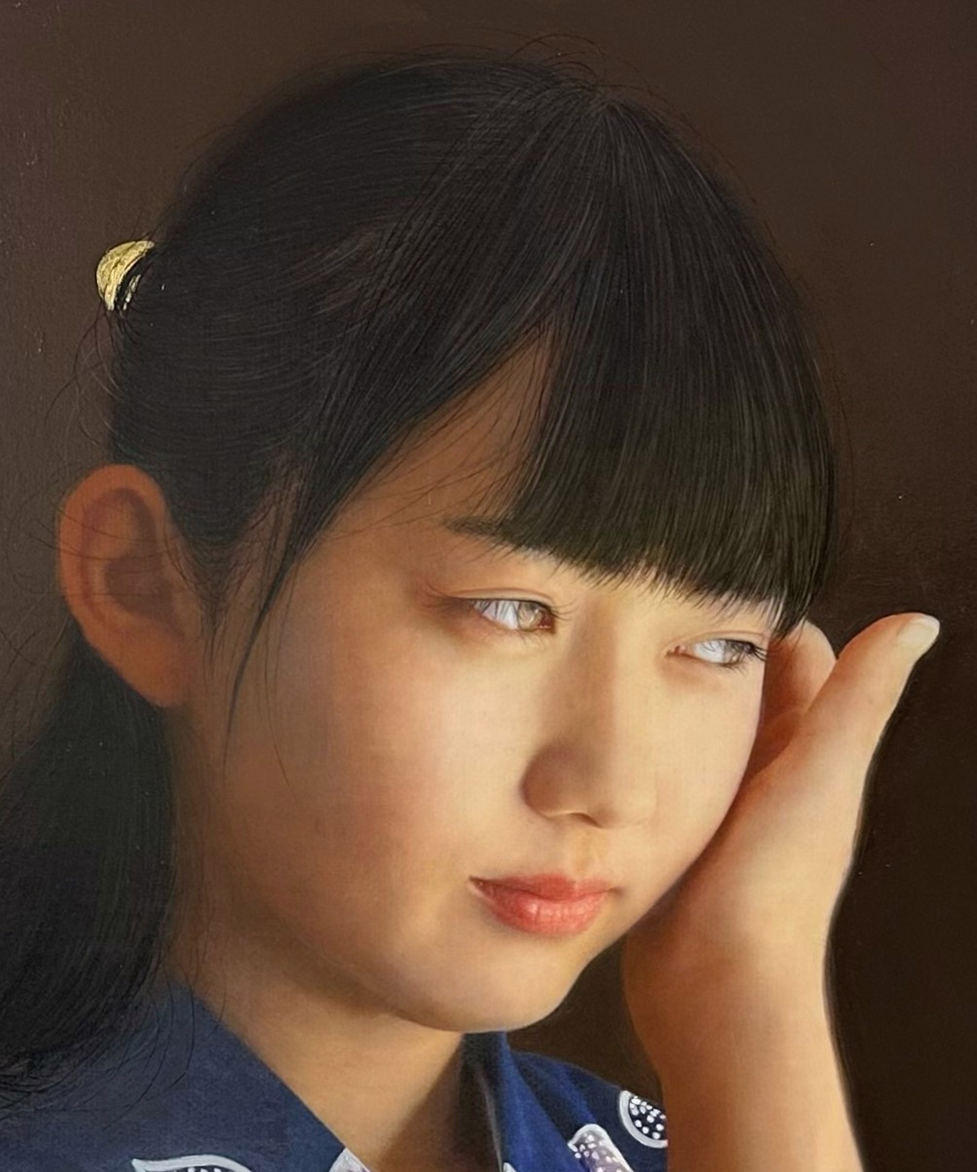A painting of a young girl in a blue kimono.