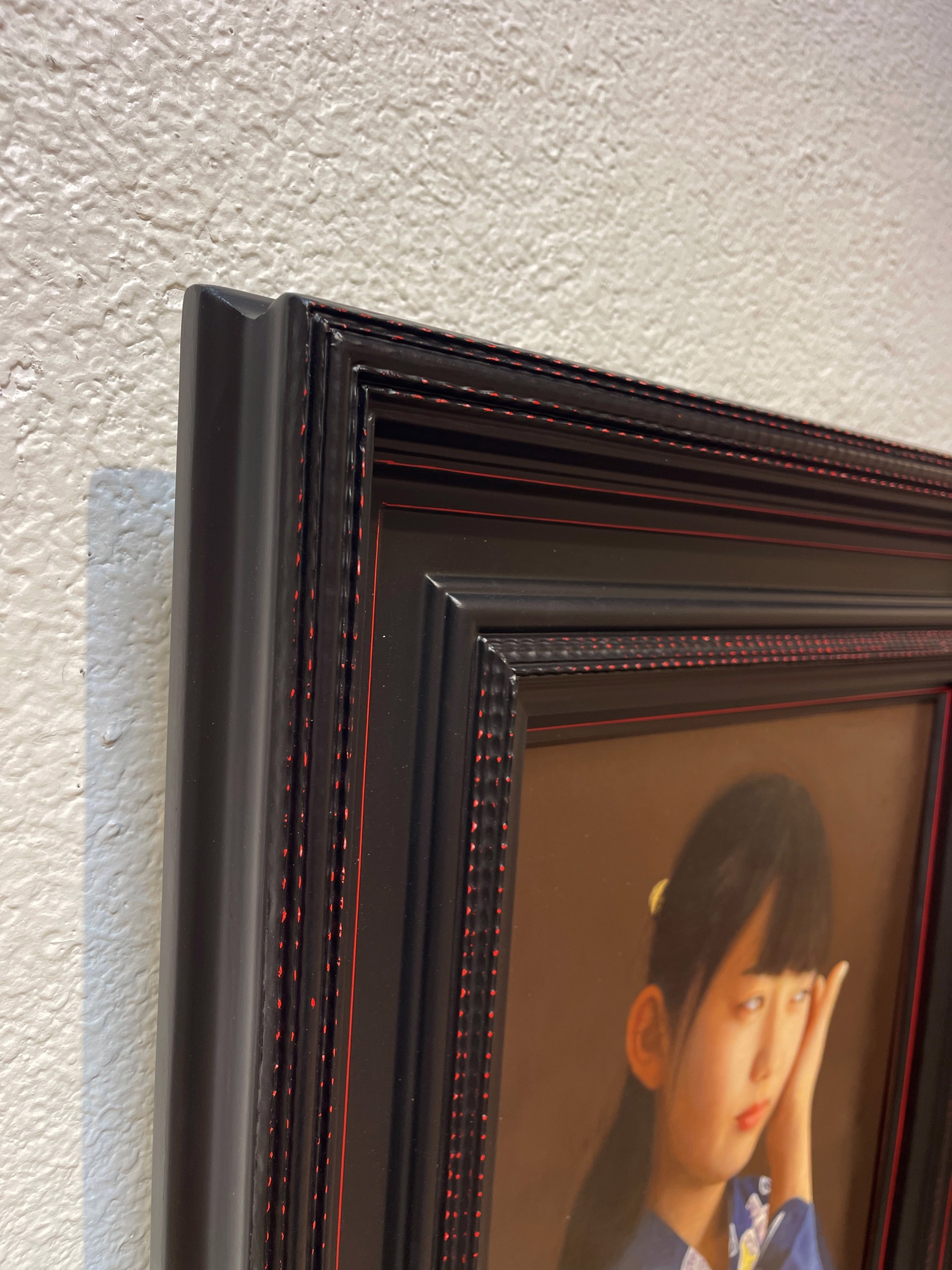 A painting of a young girl in a blue kimono.