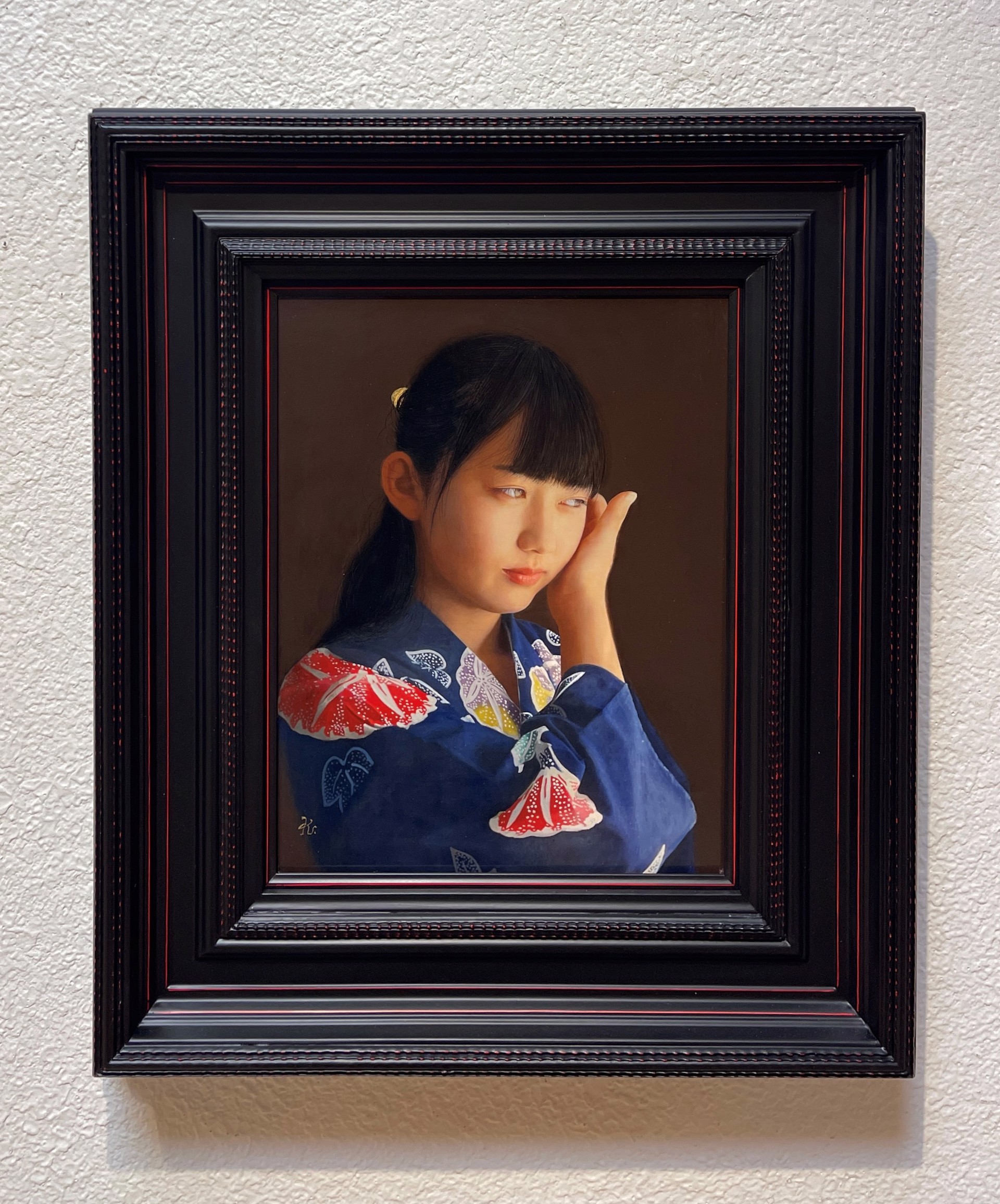 A painting of a young girl in a blue kimono.
