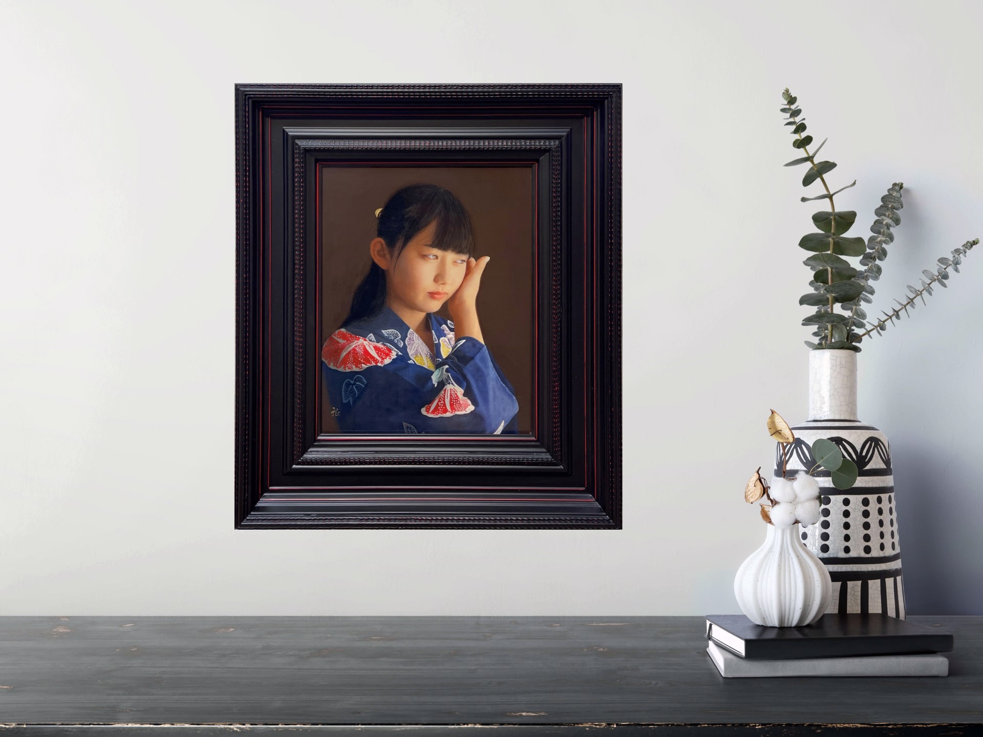 A painting of a young girl in a blue kimono.