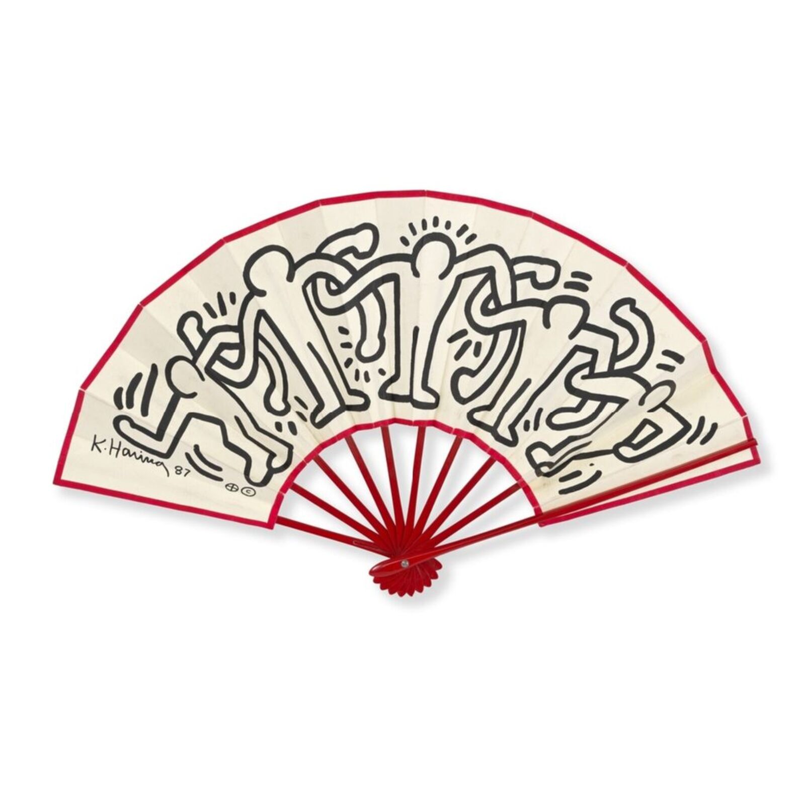 A red and white fan with a drawing on it.