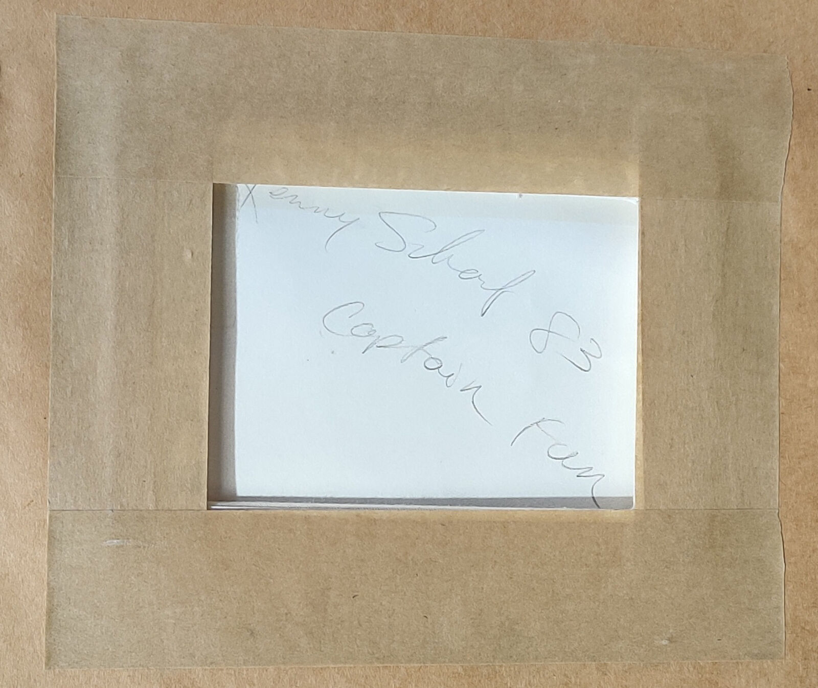 A pink drawing of a man with a hat on his head.