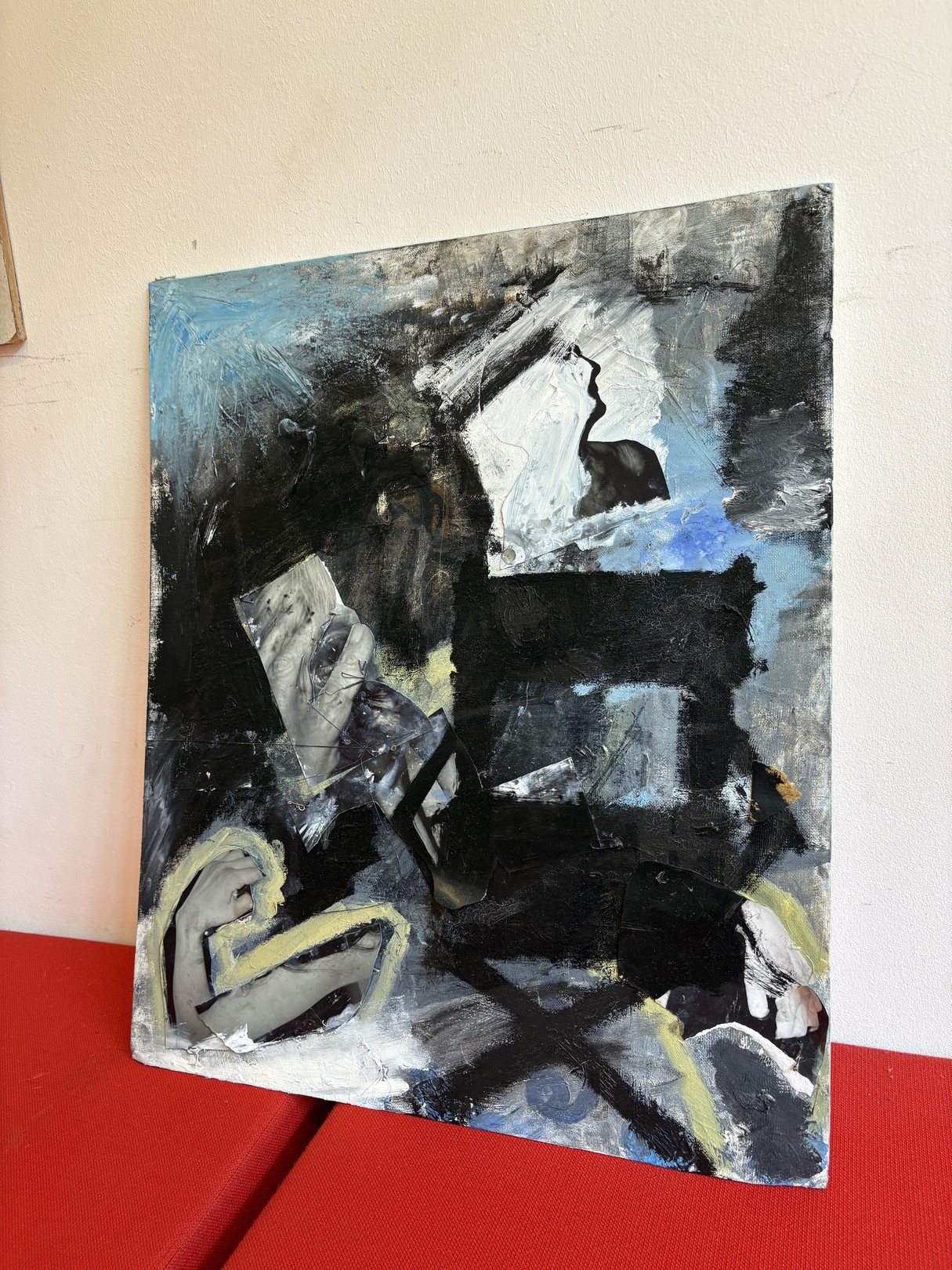 An abstract expressionist oil painting on canvas featuring a figure in shadow against a red surface.