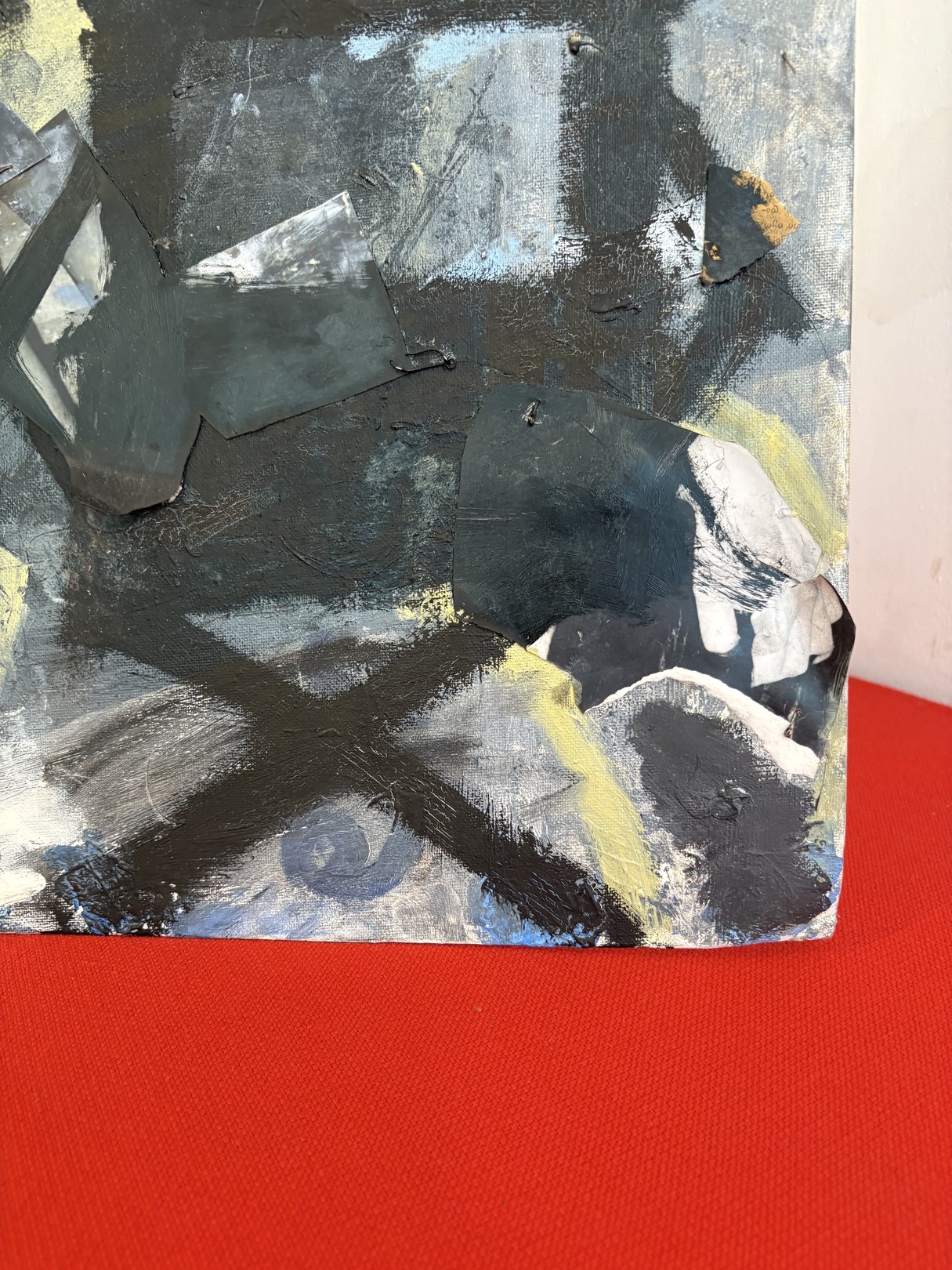 An abstract expressionist oil painting on canvas featuring a figure in shadow against a red surface.
