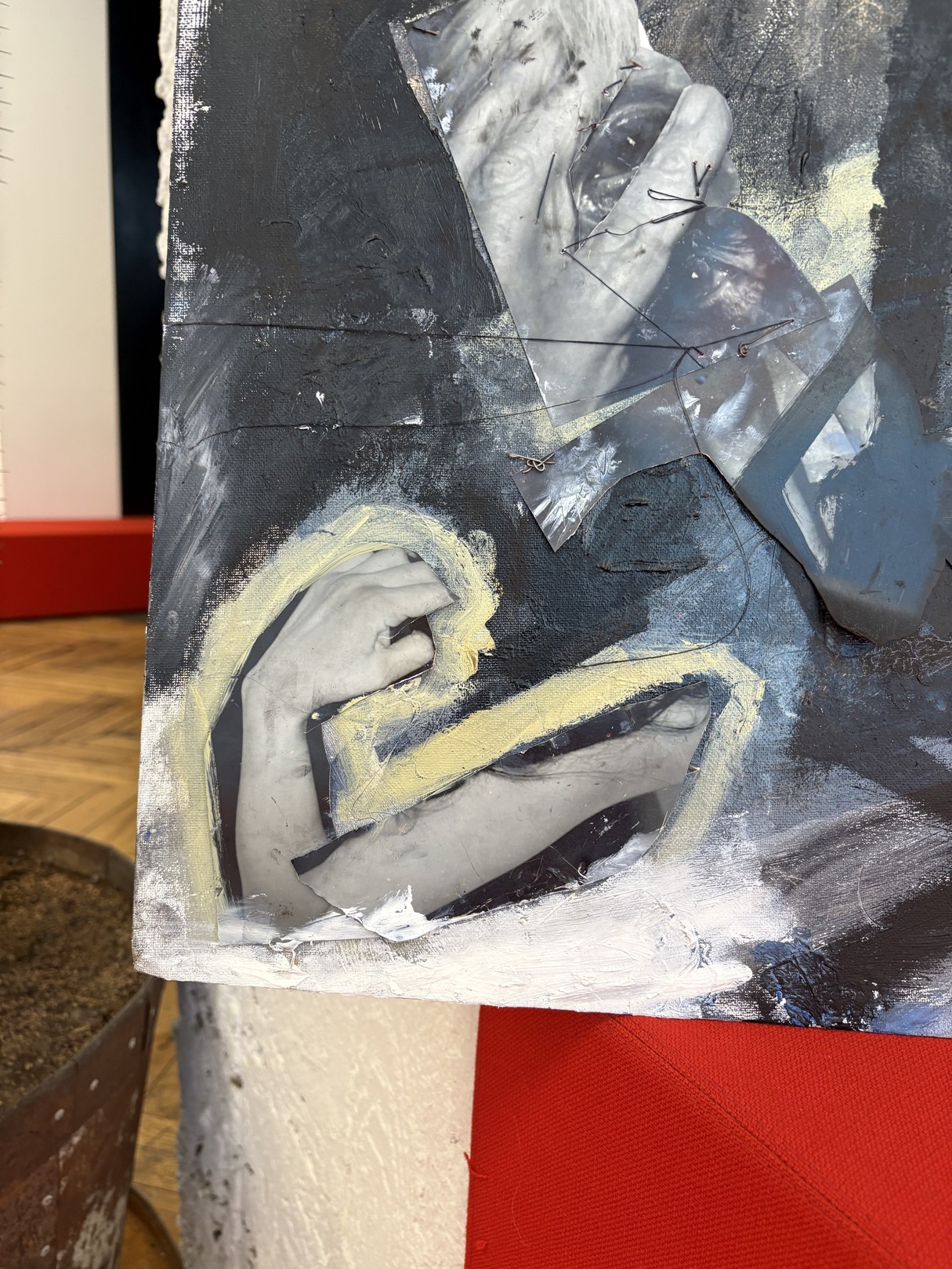 An abstract expressionist oil painting on canvas featuring a figure in shadow against a red surface.