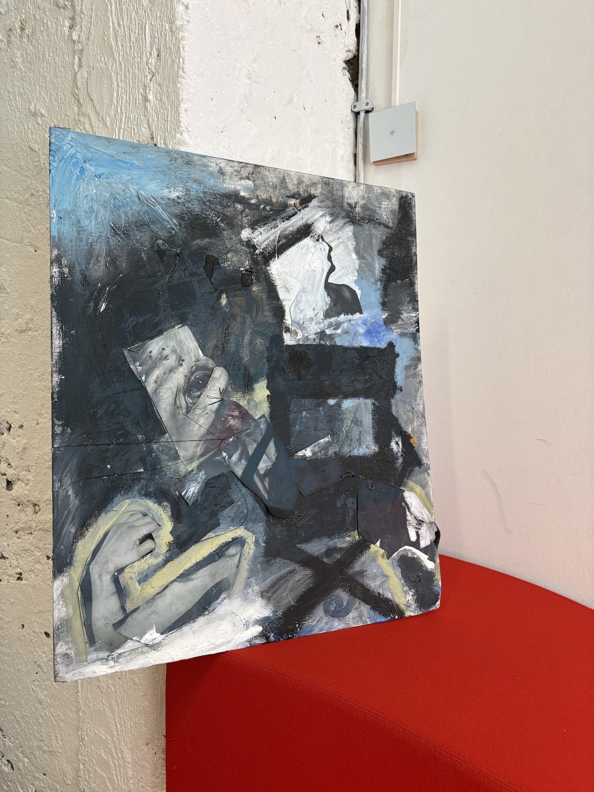 An abstract expressionist oil painting on canvas featuring a figure in shadow against a red surface.