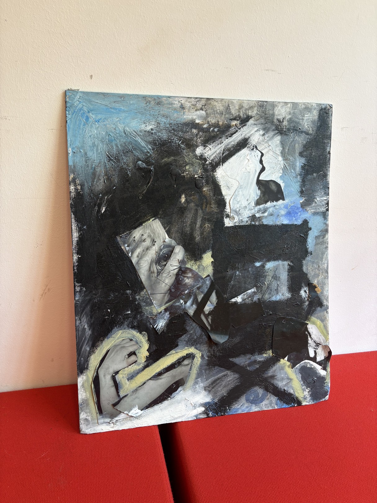 An abstract expressionist oil painting on canvas featuring a figure in shadow against a red surface.