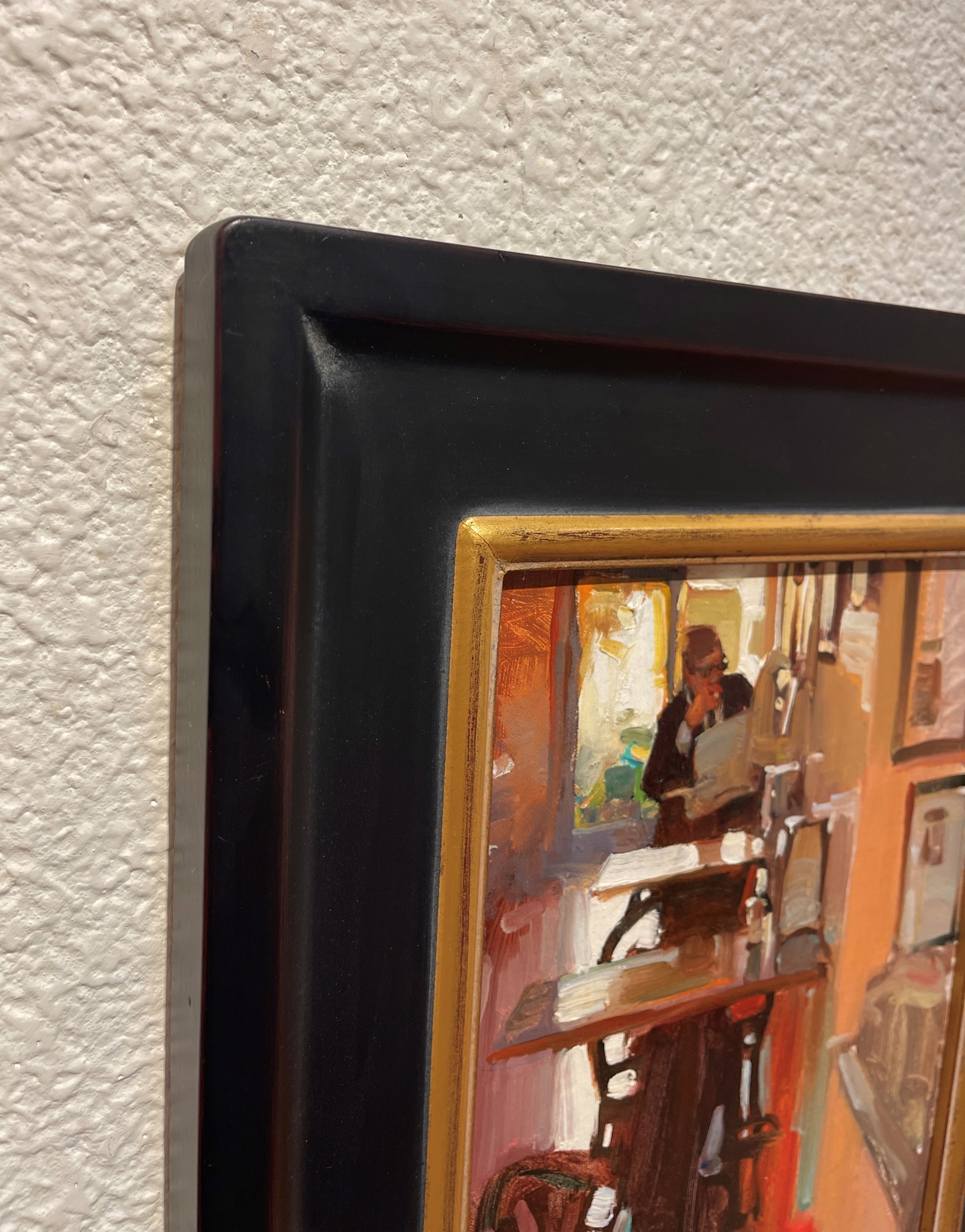 A painting of a man sitting at a table in a room.