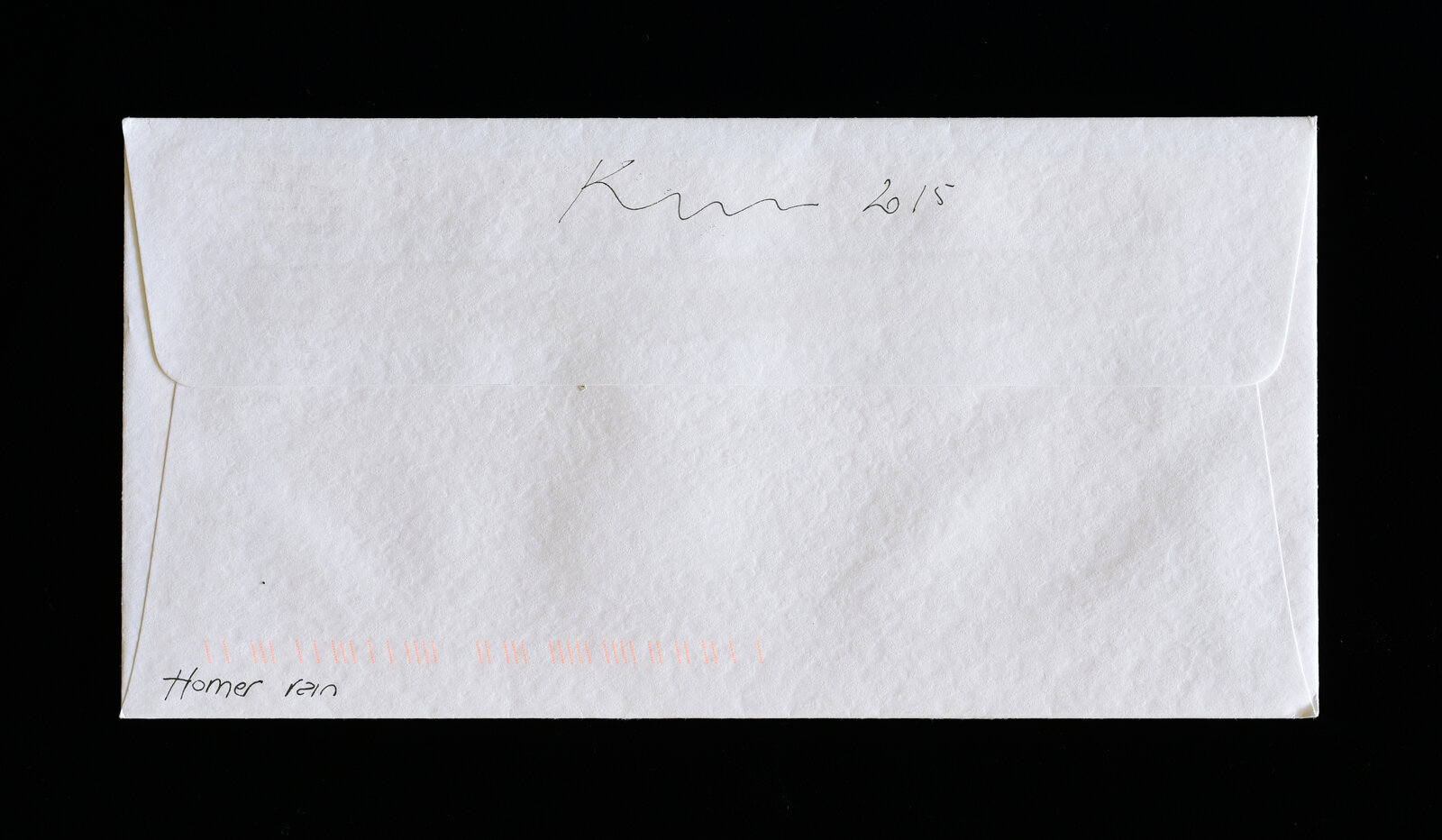 A white envelope with a pixelated portrait stamp and postmark against a black background.