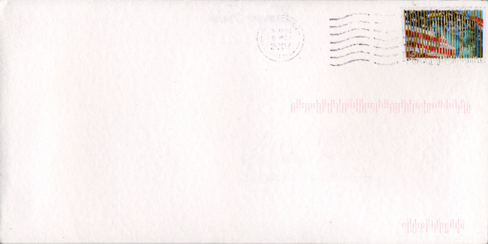 A minimalist white envelope with a colorful postage stamp and faint red markings.