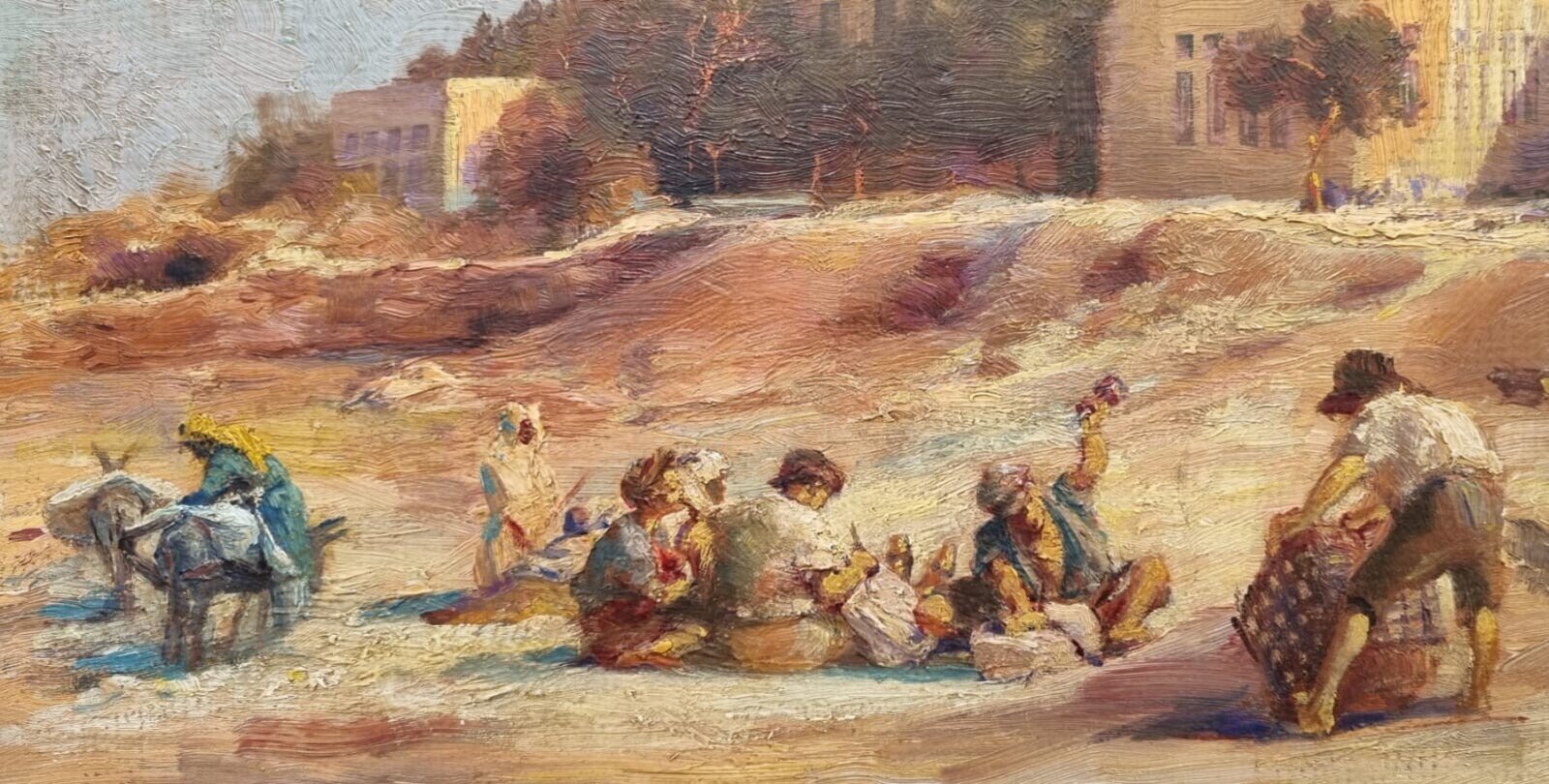A sun-drenched street scene with figures resting near a large building.
