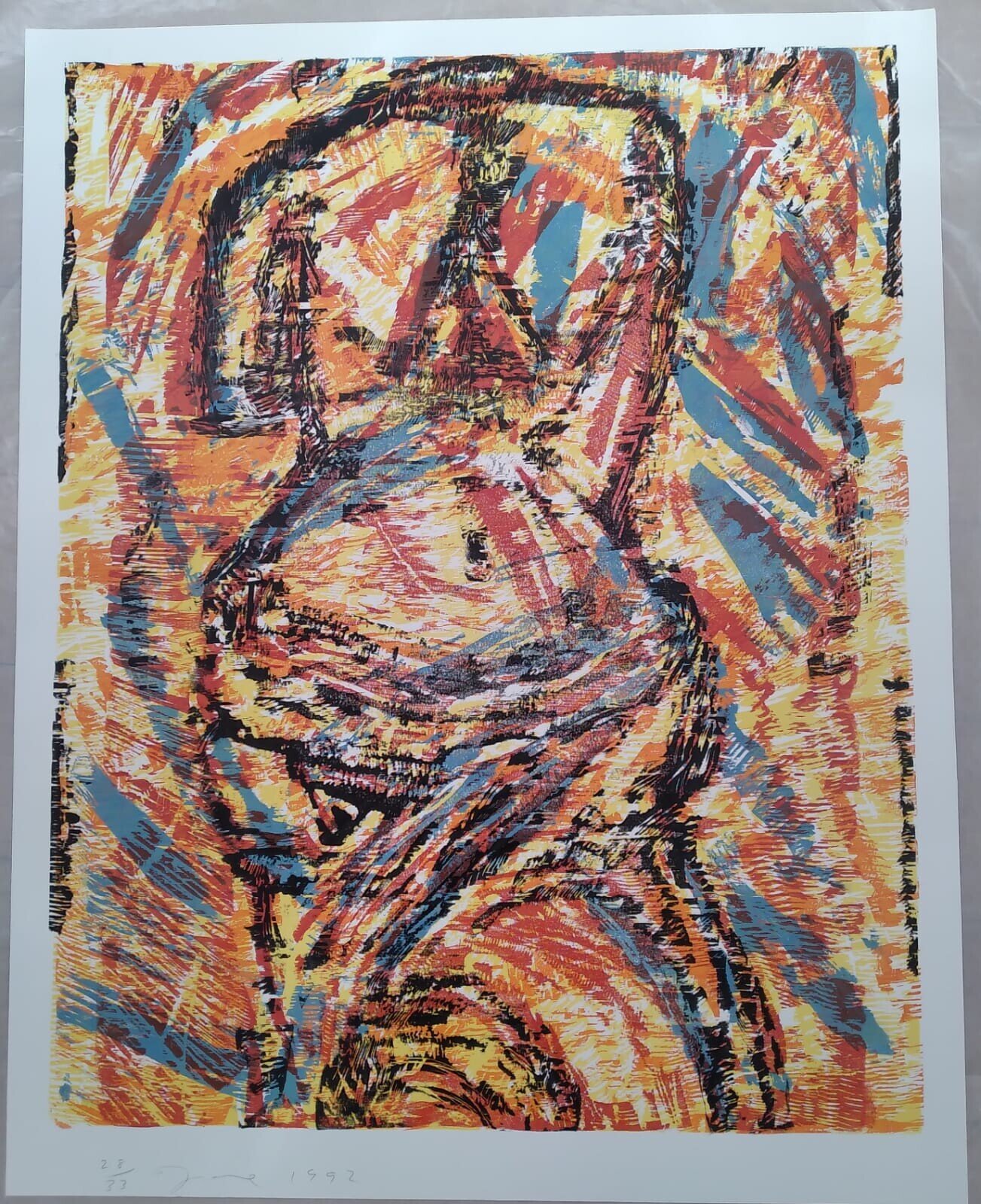 A triptych of expressive linocut prints featuring a stylized face, a heart shape, and abstract forms.