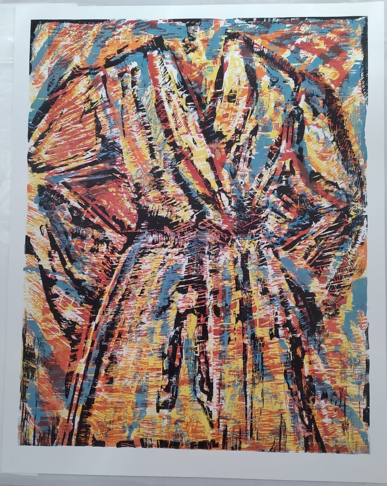 A triptych of expressive linocut prints featuring a stylized face, a heart shape, and abstract forms.