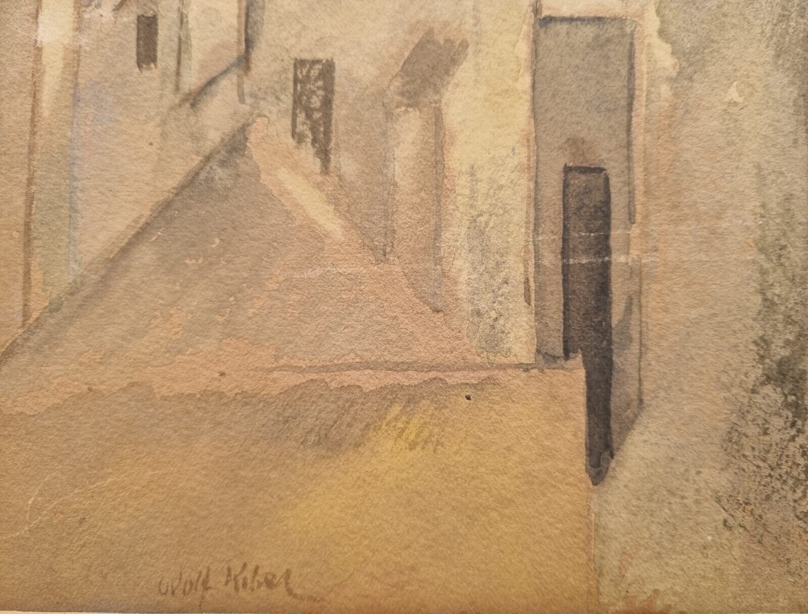 A watercolor landscape of a sun-drenched village with blocky buildings and distant mountains.