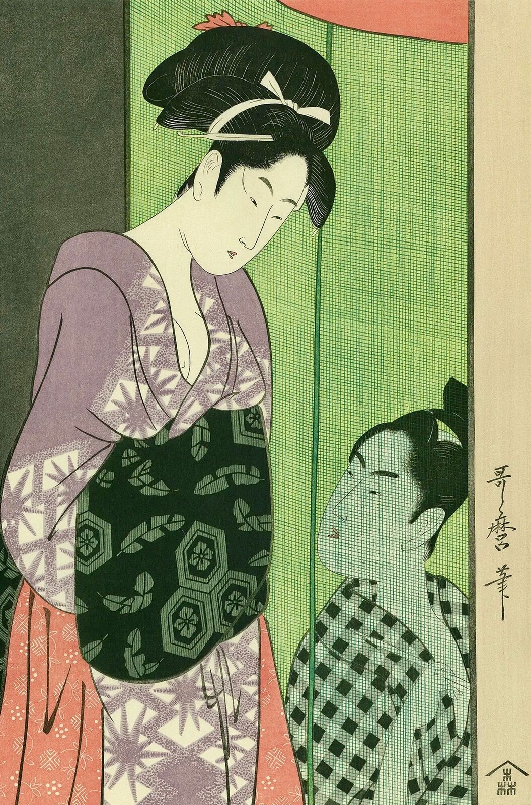 A woman in a kimono looking at herself in the mirror.