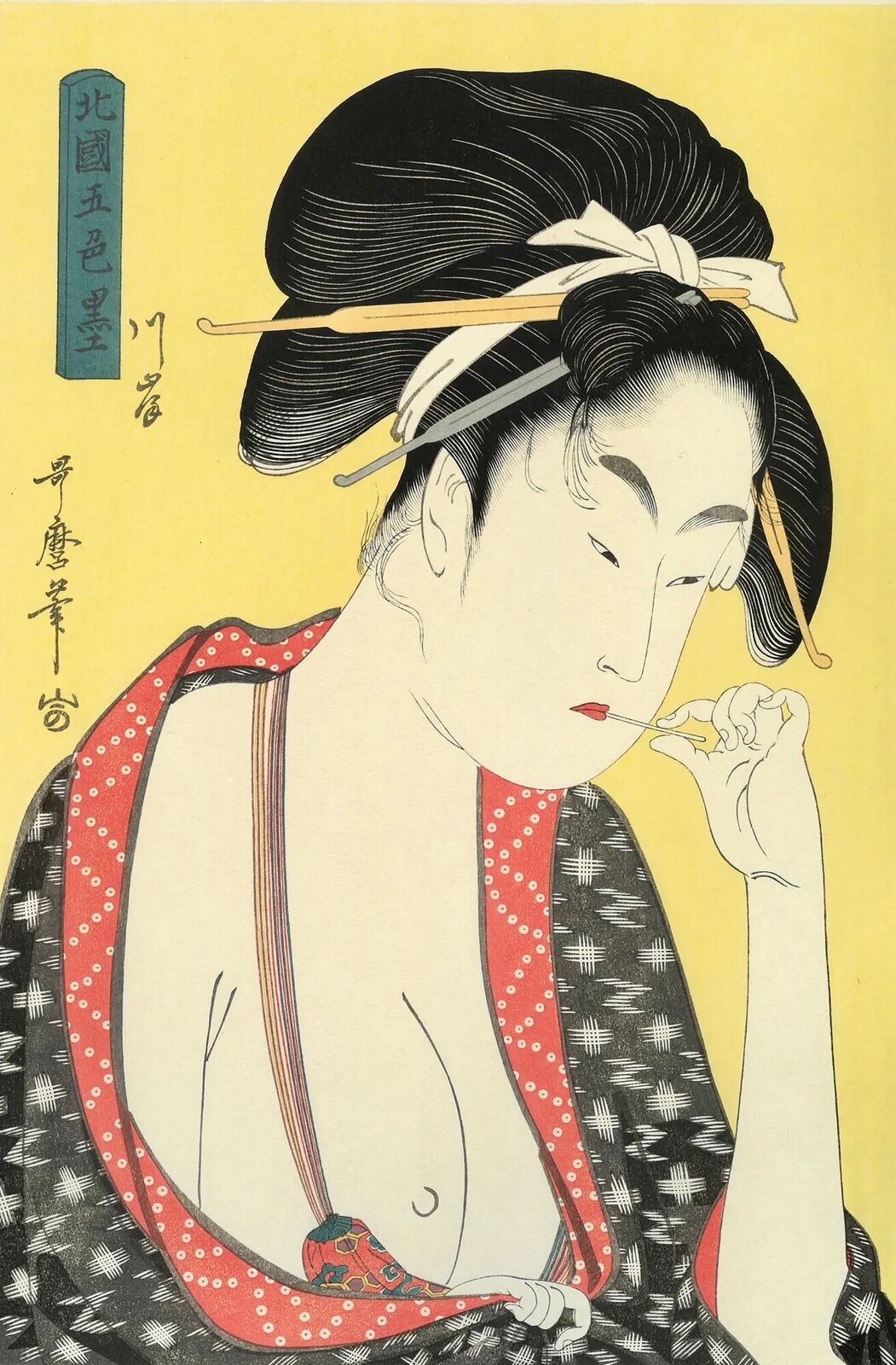 A woman in a kimono smoking a cigarette. 