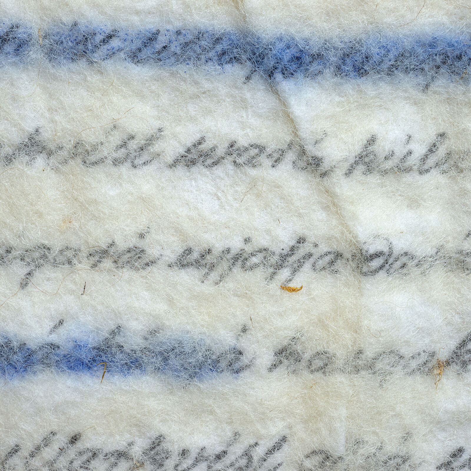 A minimalist textile artwork featuring blue and black script on a cream-colored felt, mounted on light wood.