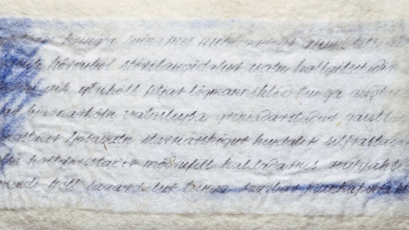 A piece of paper with writing on it sitting on a shelf.