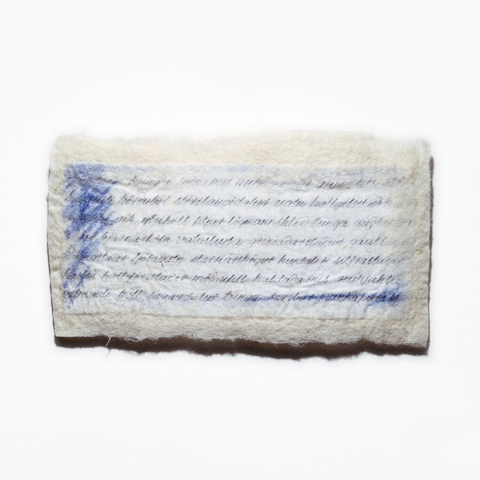 A piece of paper with writing on it sitting on a shelf.